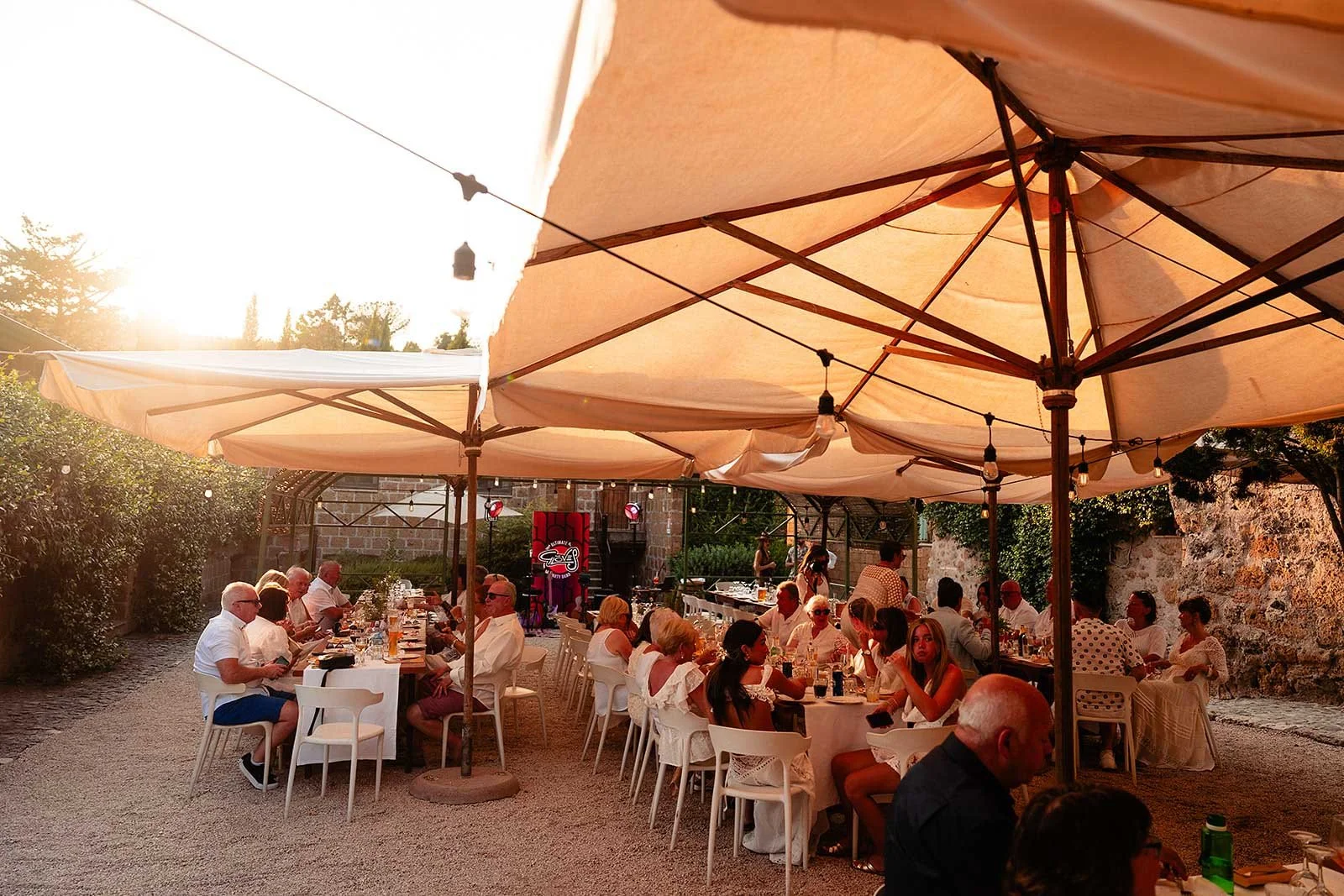 16. Guests dressed in white for dinner and karaoke at Borgo di Tragliata-15.jpg