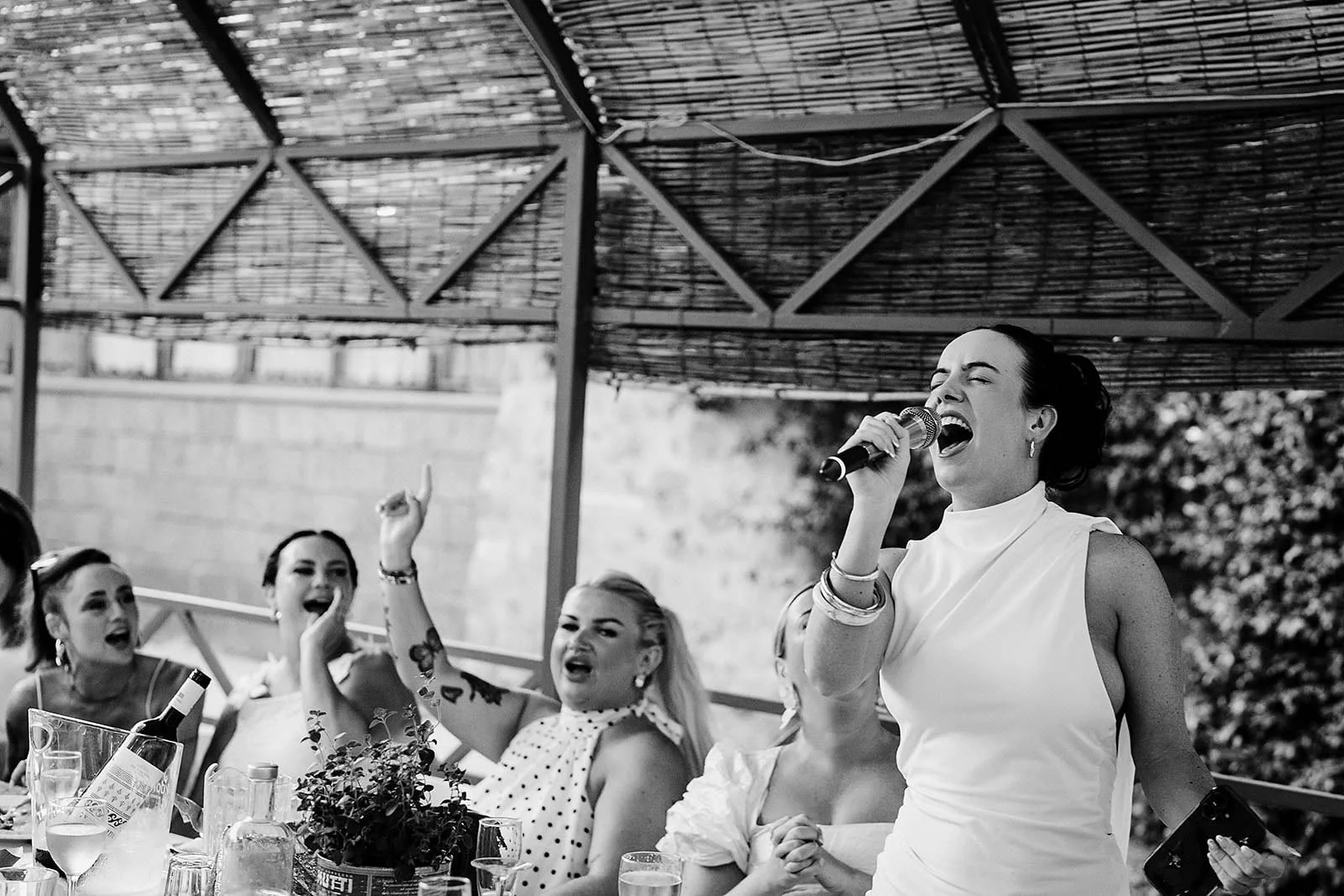 16. Guests dressed in white for dinner and karaoke at Borgo di Tragliata-19.jpg