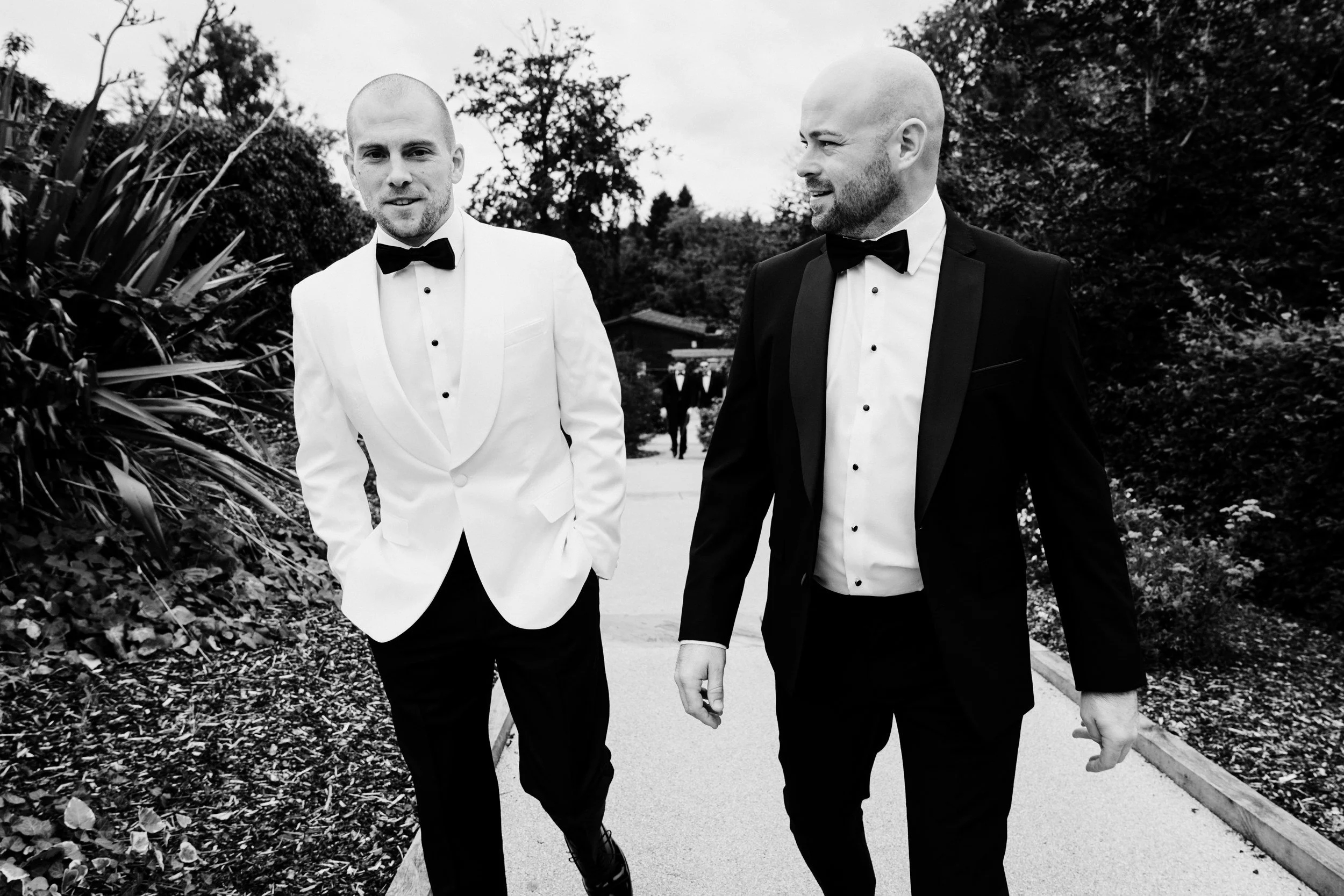galgorm-wedding-photographer-holly-matt-17-matt-and-groomsman-walking.jpg