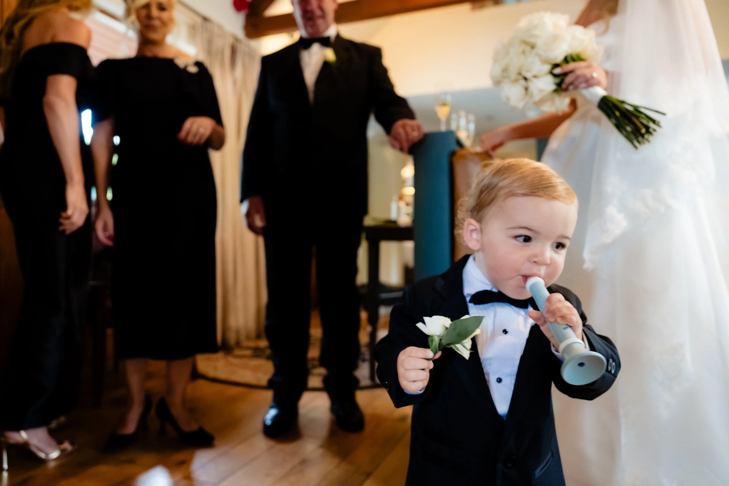 galgorm-wedding-photographer-holly-matt-23-page-boy-with-trumpet.jpg