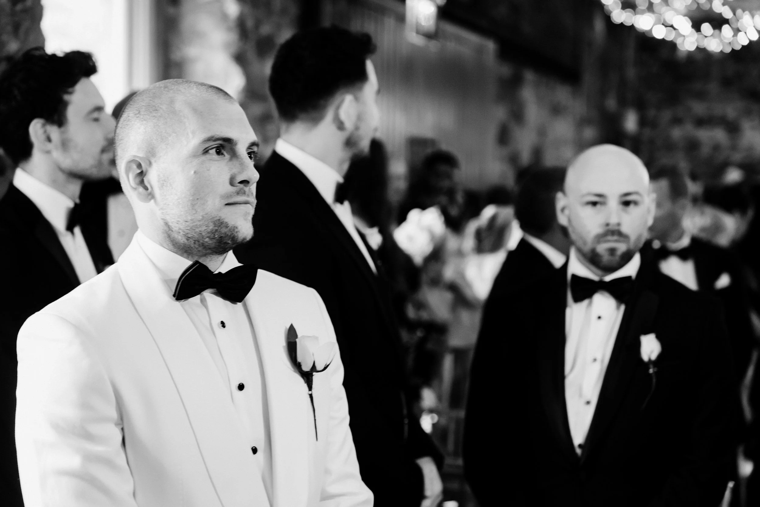 galgorm-wedding-photographer-holly-matt-32-matt-waiting-at-the-top-of-the-aisle.jpg