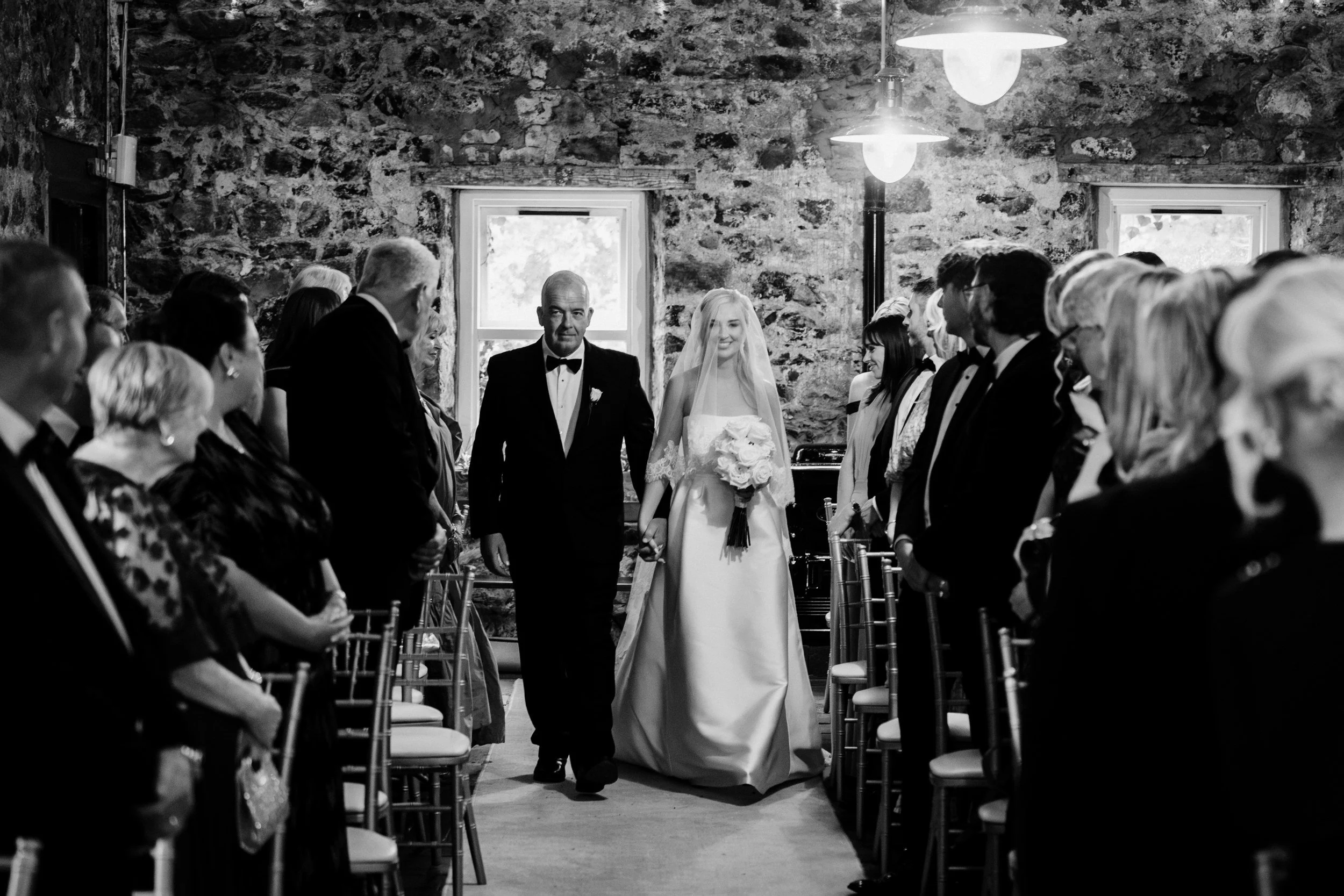 galgorm-wedding-photographer-holly-matt-33-holly-and-dad-walk-the-aisle.jpg