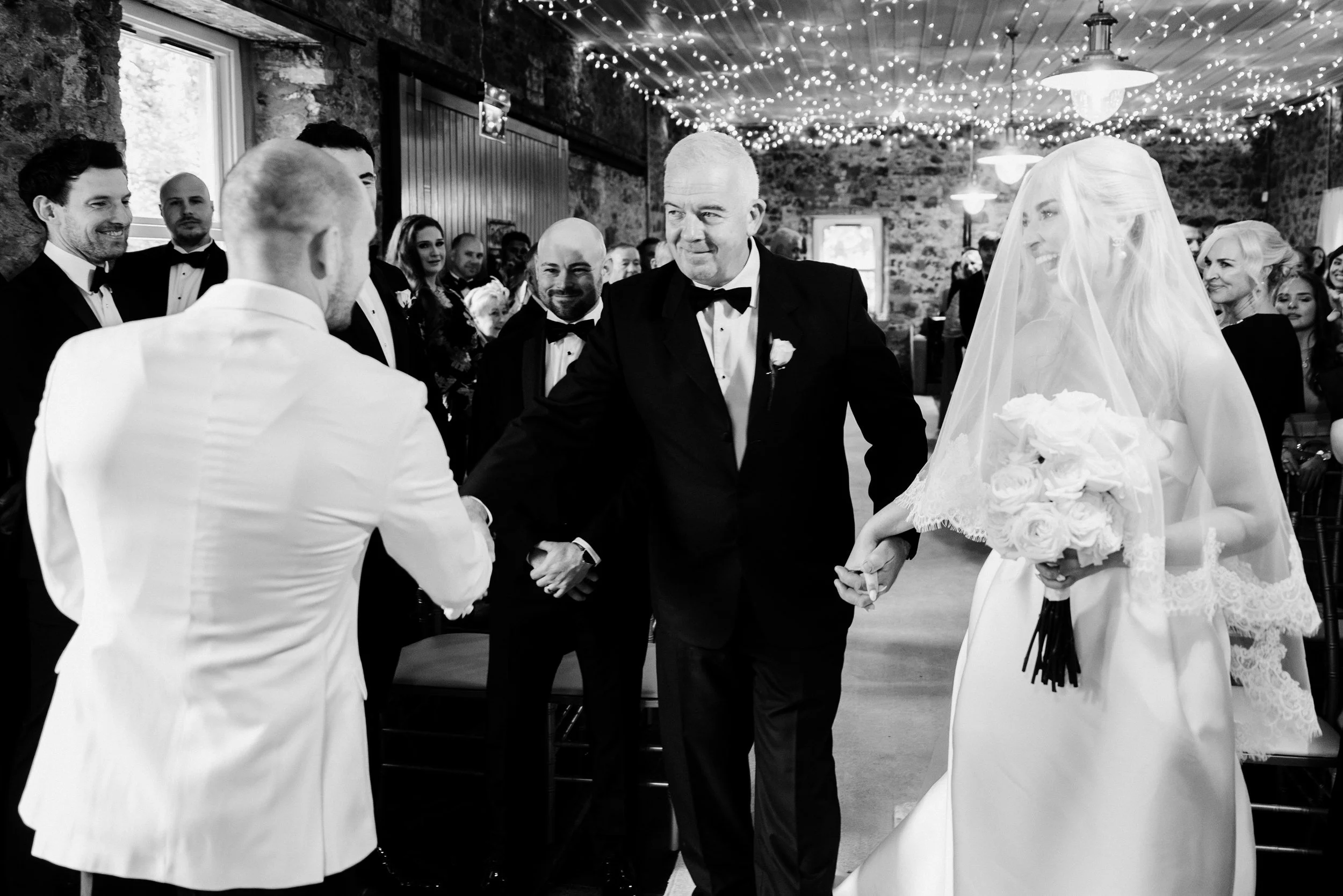 galgorm-wedding-photographer-holly-matt-34-dad-hands-holly-over.jpg