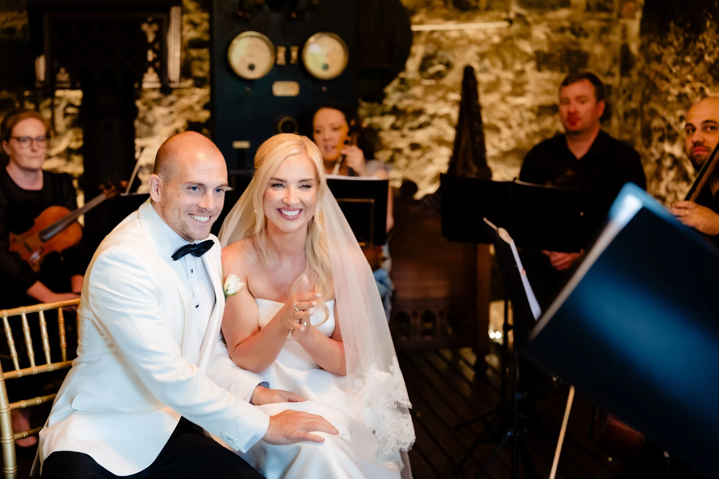 galgorm-wedding-photographer-holly-matt-36-holly-and-matt-laughing-during-the-ceremony.jpg