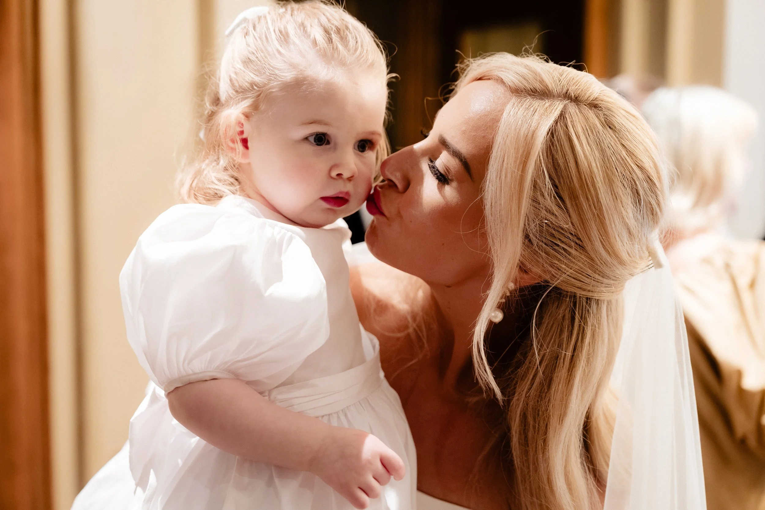 galgorm-wedding-photographer-holly-matt-54-holly-kisses-flower-girl.jpg