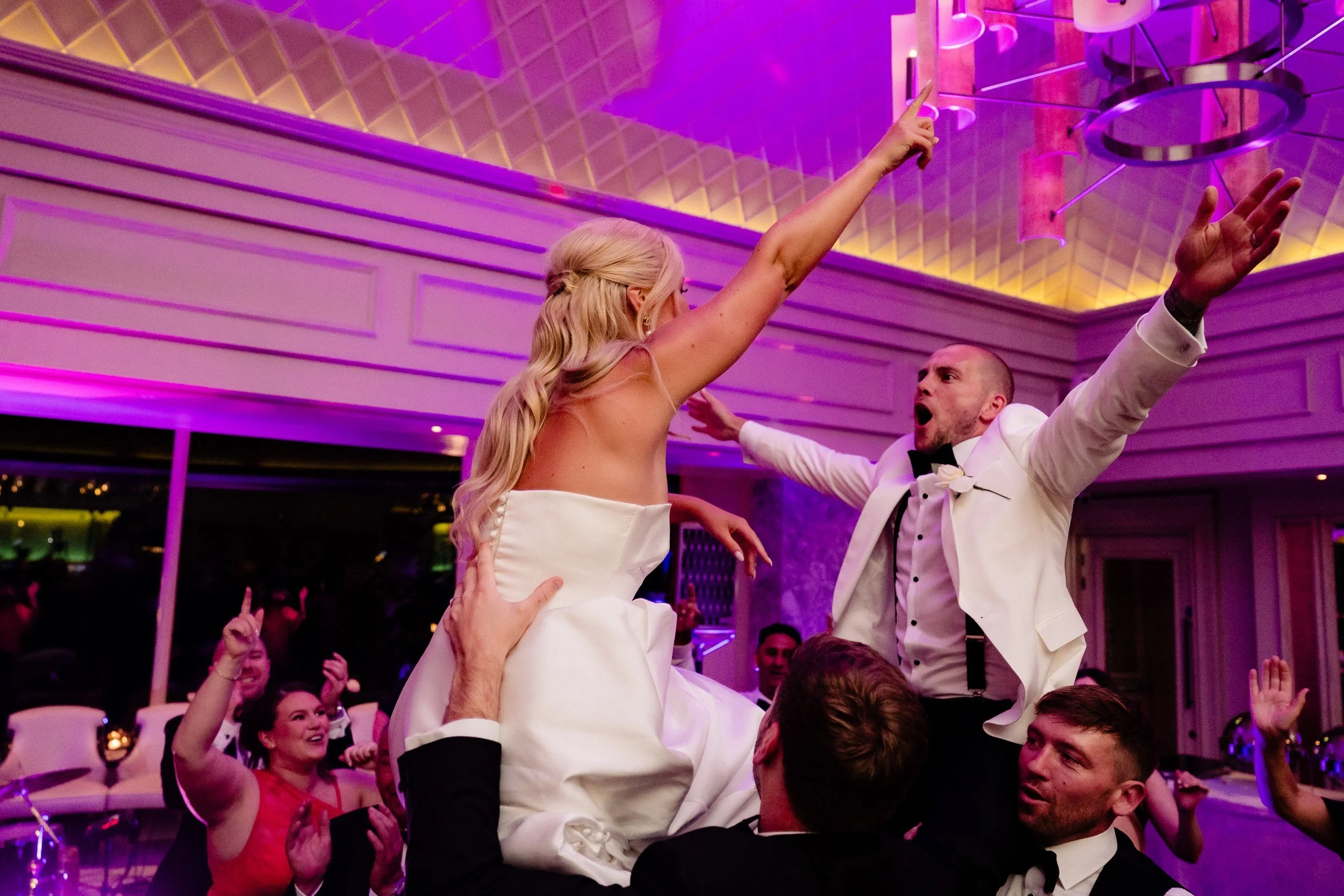 galgorm-wedding-photographer-holly-matt-68-arms-in-the-air.jpg