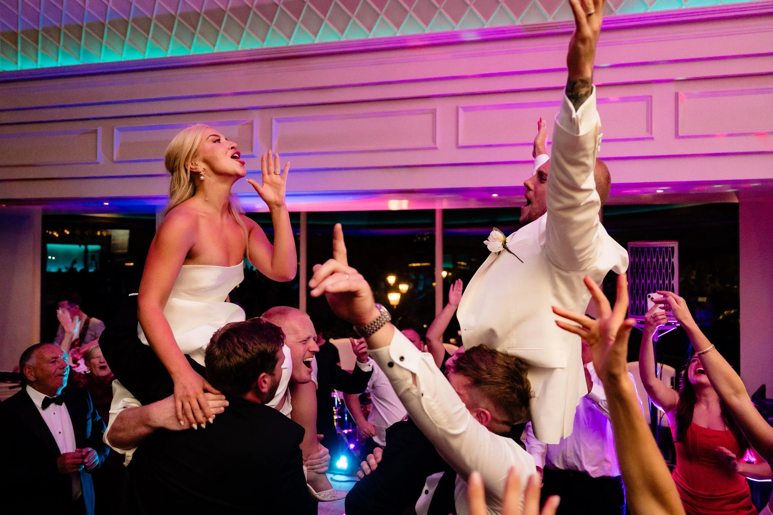 galgorm-wedding-photographer-holly-matt-69-holly-on-shoulders.jpg
