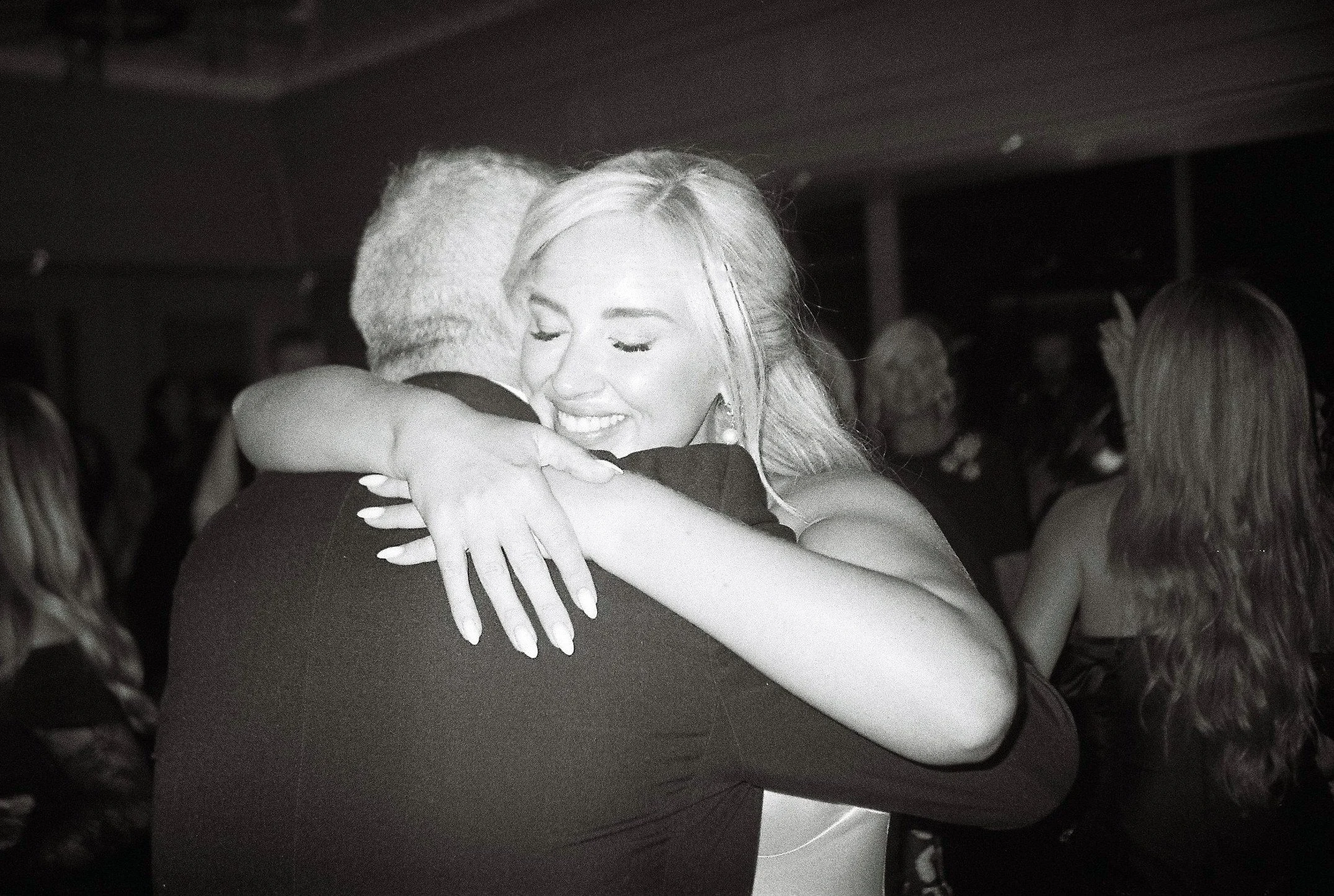 galgorm-wedding-photographer-holly-matt-79-film-hug-on-the-dance-floor.jpg
