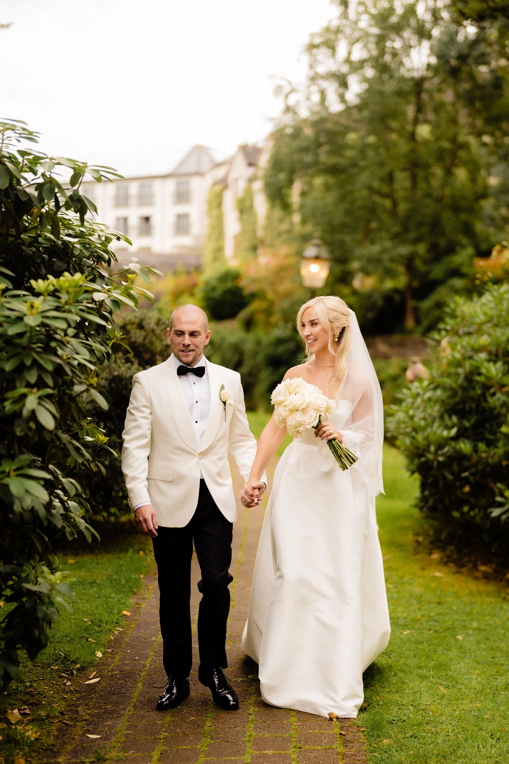 galgorm-wedding-photographer-holly-matt-50-walking-through-the-gardens.jpg