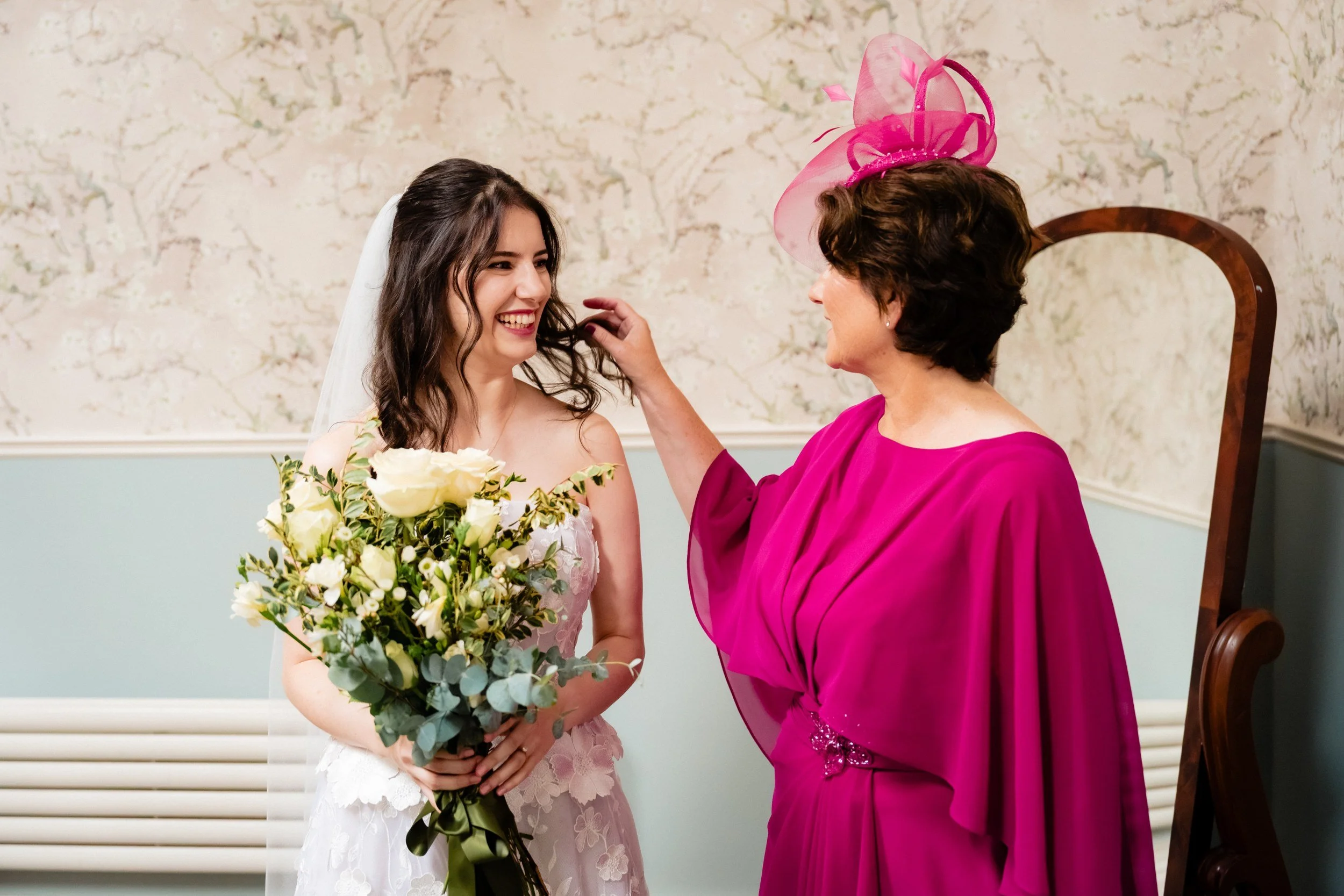 tinakilly-wedding-photographer-laura-james-08-mum-fixing-the-veil.jpg