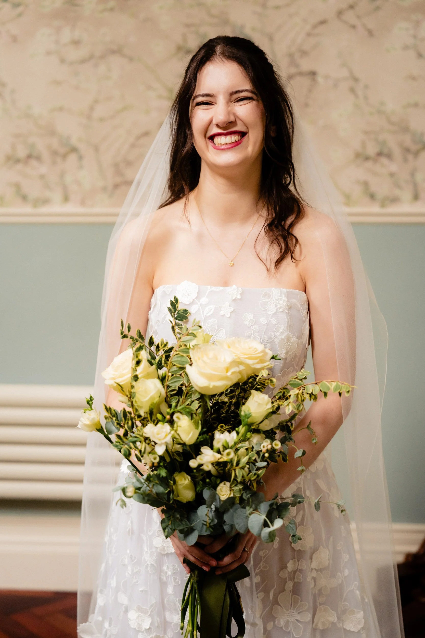 tinakilly-wedding-photographer-laura-james-10-laura-laughing-with-her-bouquet.jpg