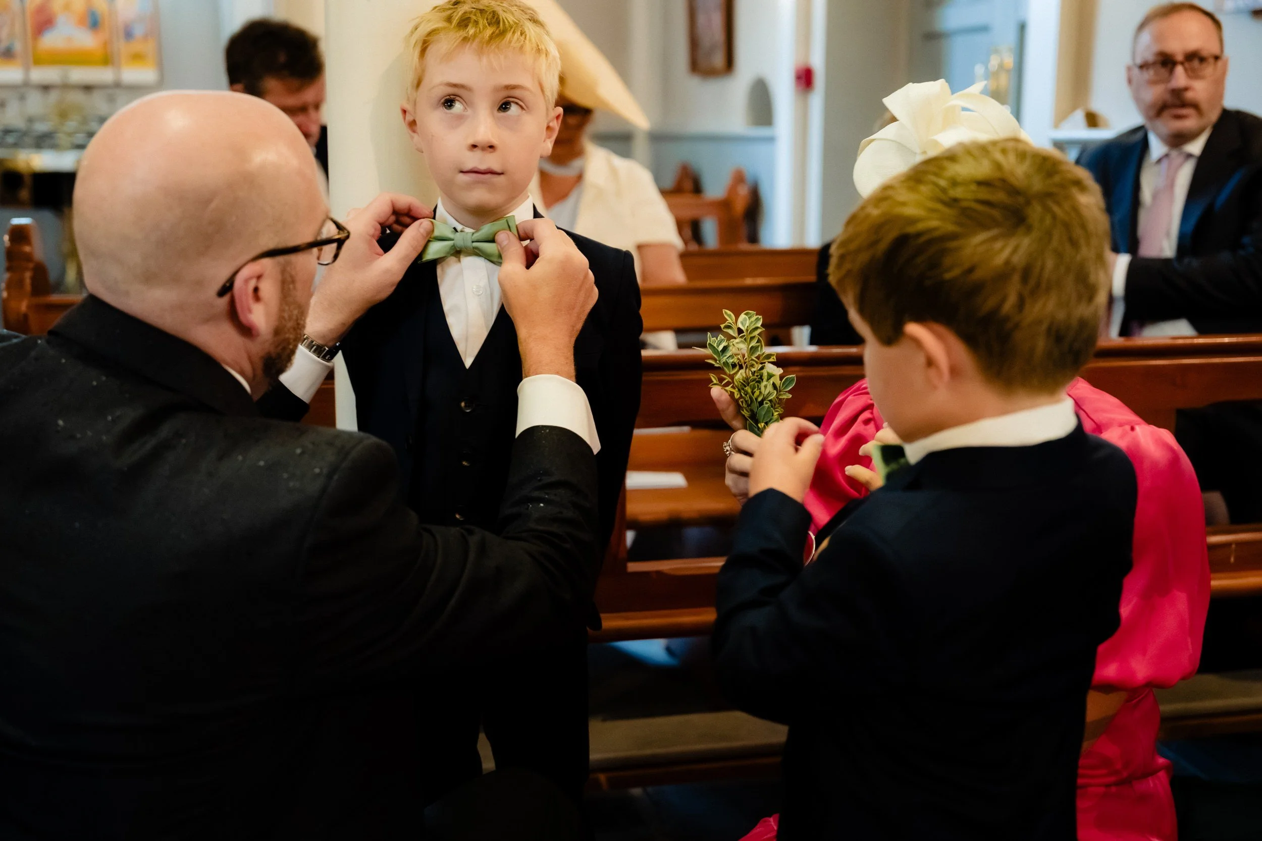 tinakilly-wedding-photographer-laura-james-13-page-boy-bow-tie.jpg