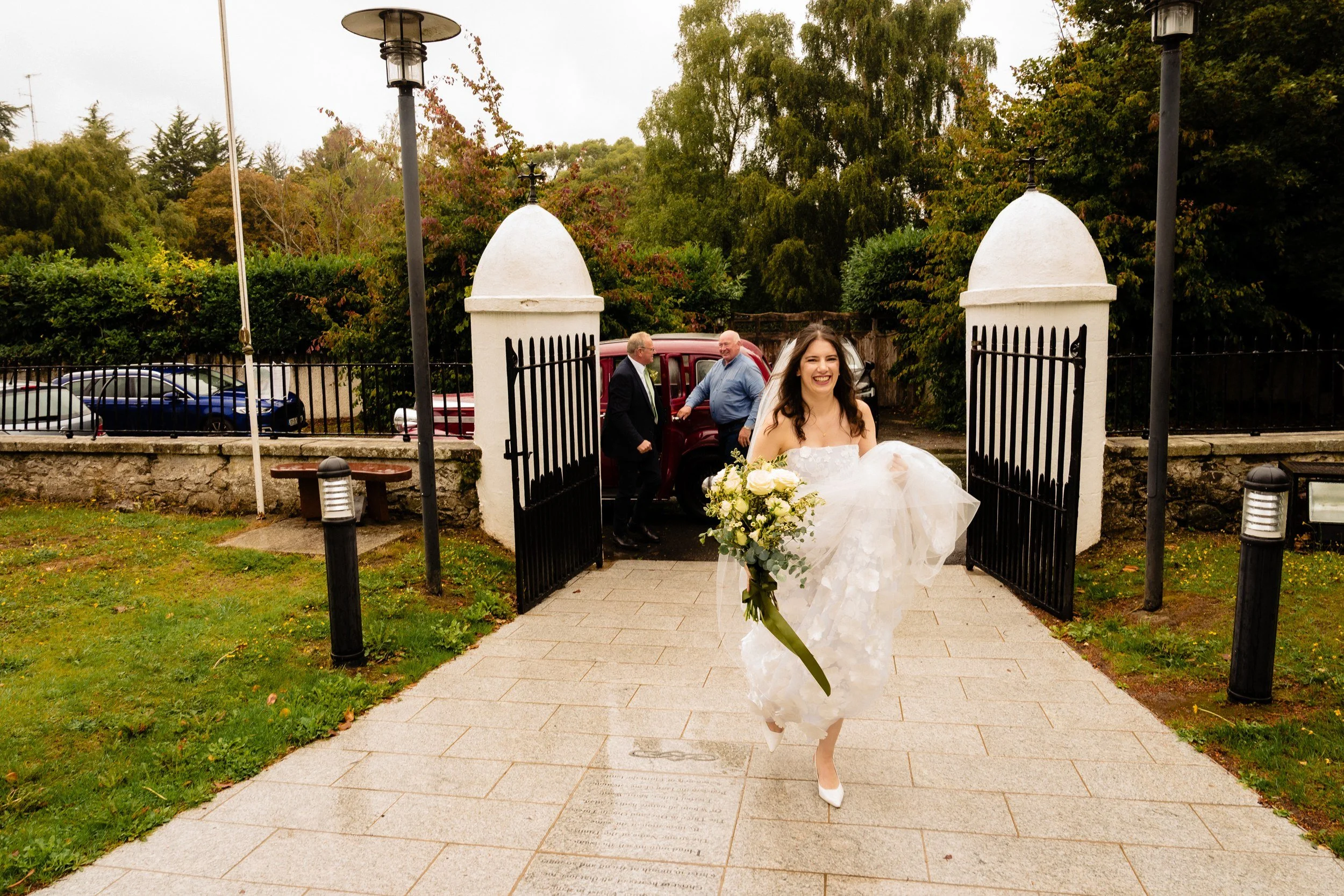 tinakilly-wedding-photographer-laura-james-19-laura-running-through-the-gates.jpg