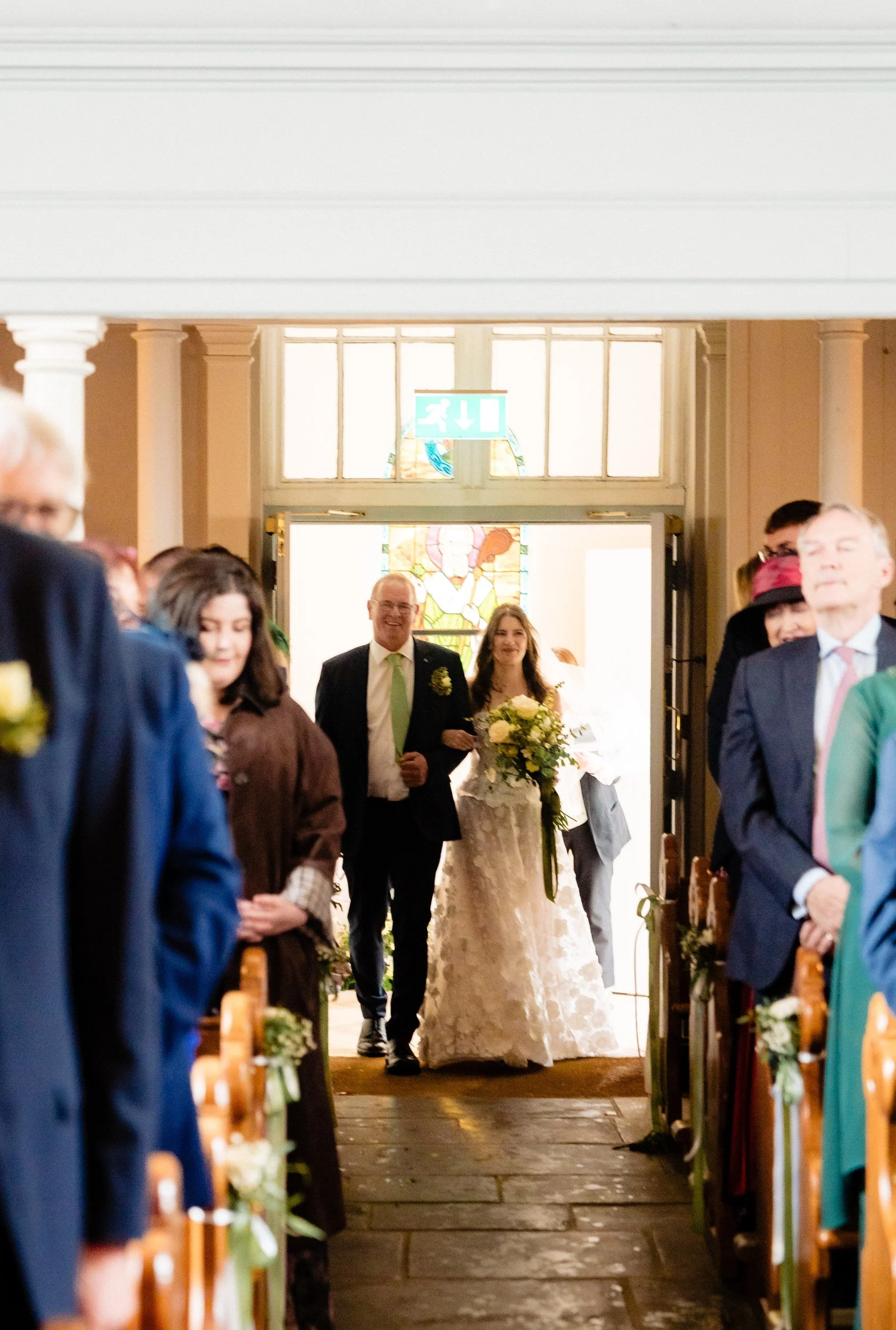 tinakilly-wedding-photographer-laura-james-23-laura-and-dad-in-the-church-doorway.jpg