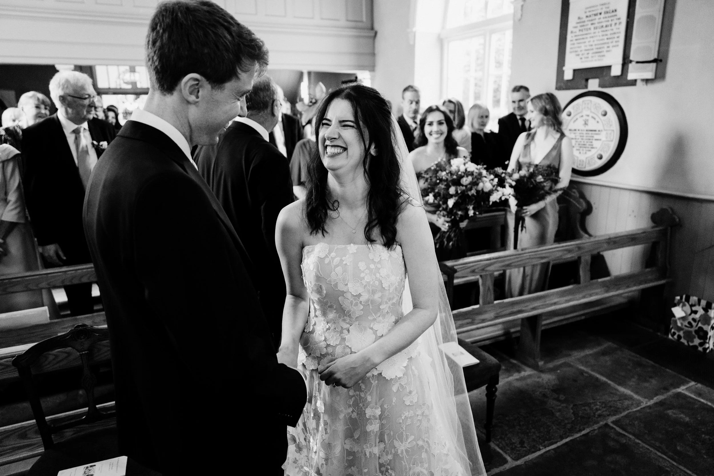 tinakilly-wedding-photographer-laura-james-26-laura-laughing-at-the-altar.jpg