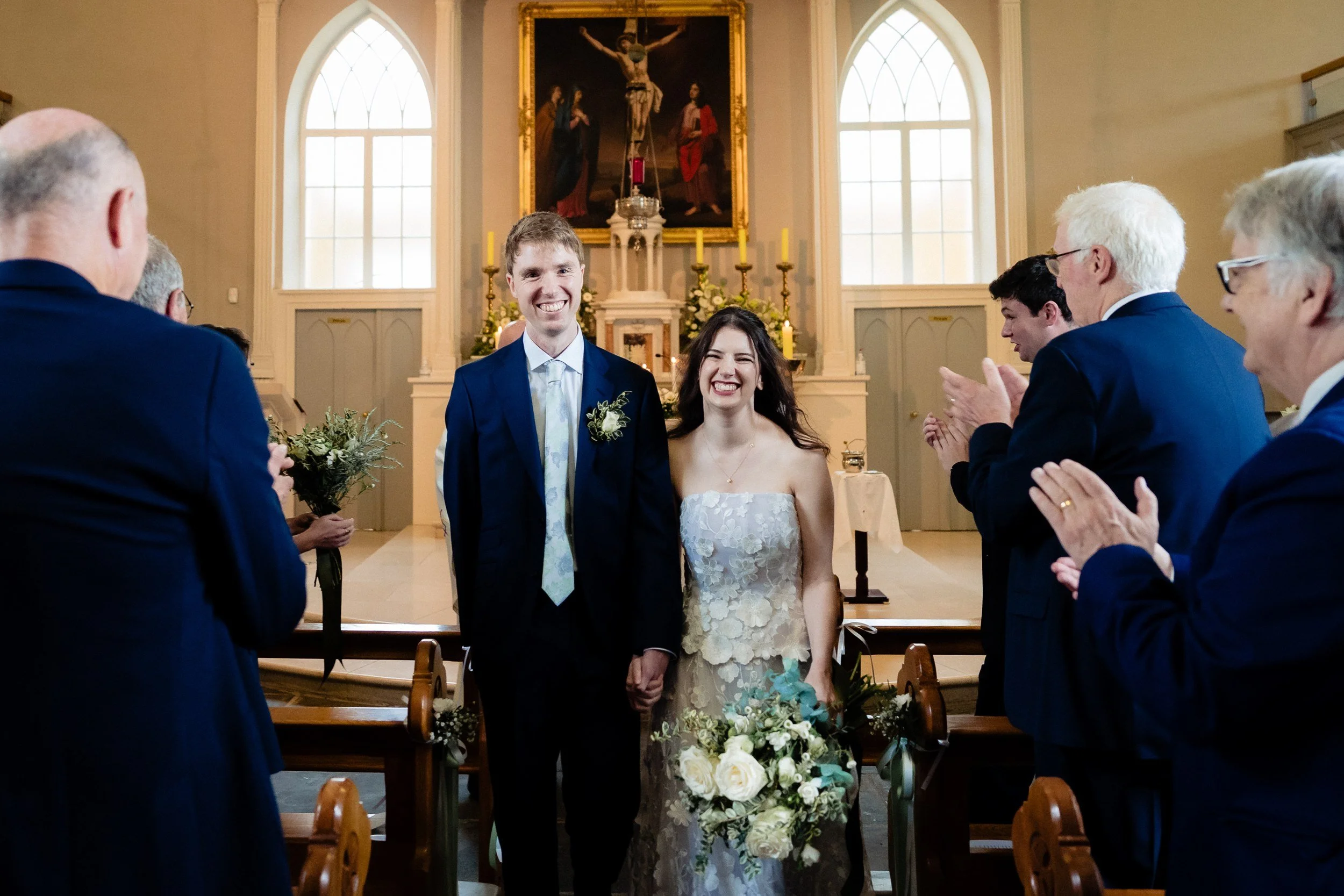 tinakilly-wedding-photographer-laura-james-33-walking-back-down-the-aisle.jpg