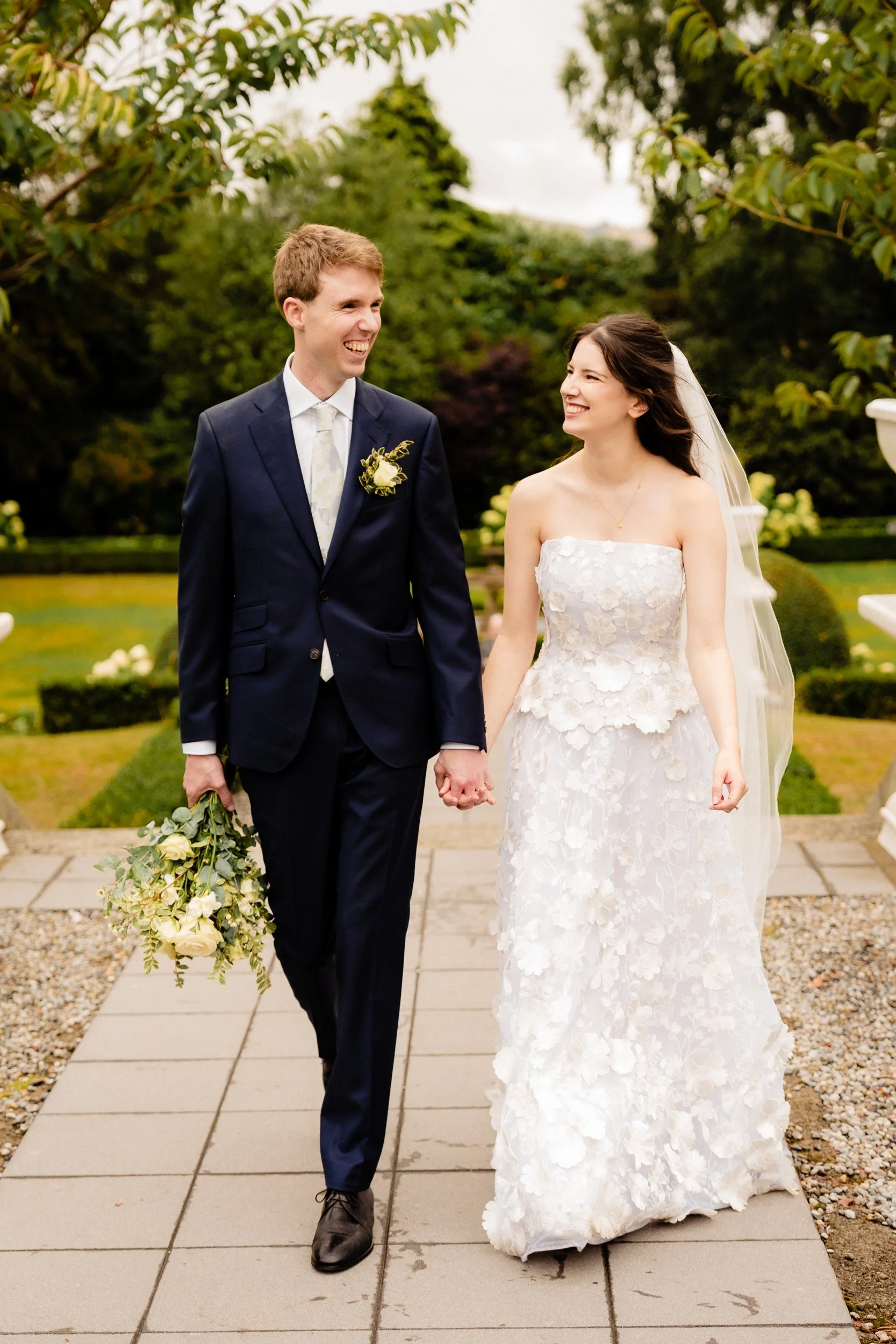 tinakilly-wedding-photographer-laura-james-47-walking-through-the-garden.jpg