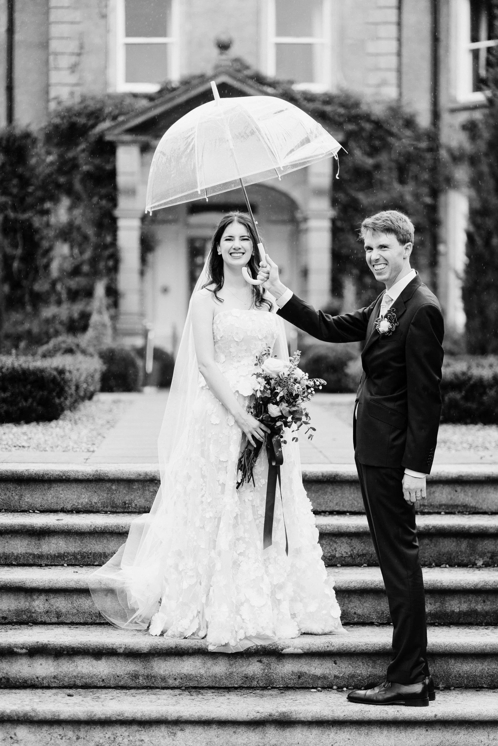 tinakilly-wedding-photographer-laura-james-49-umbrella-on-the-steps.jpg