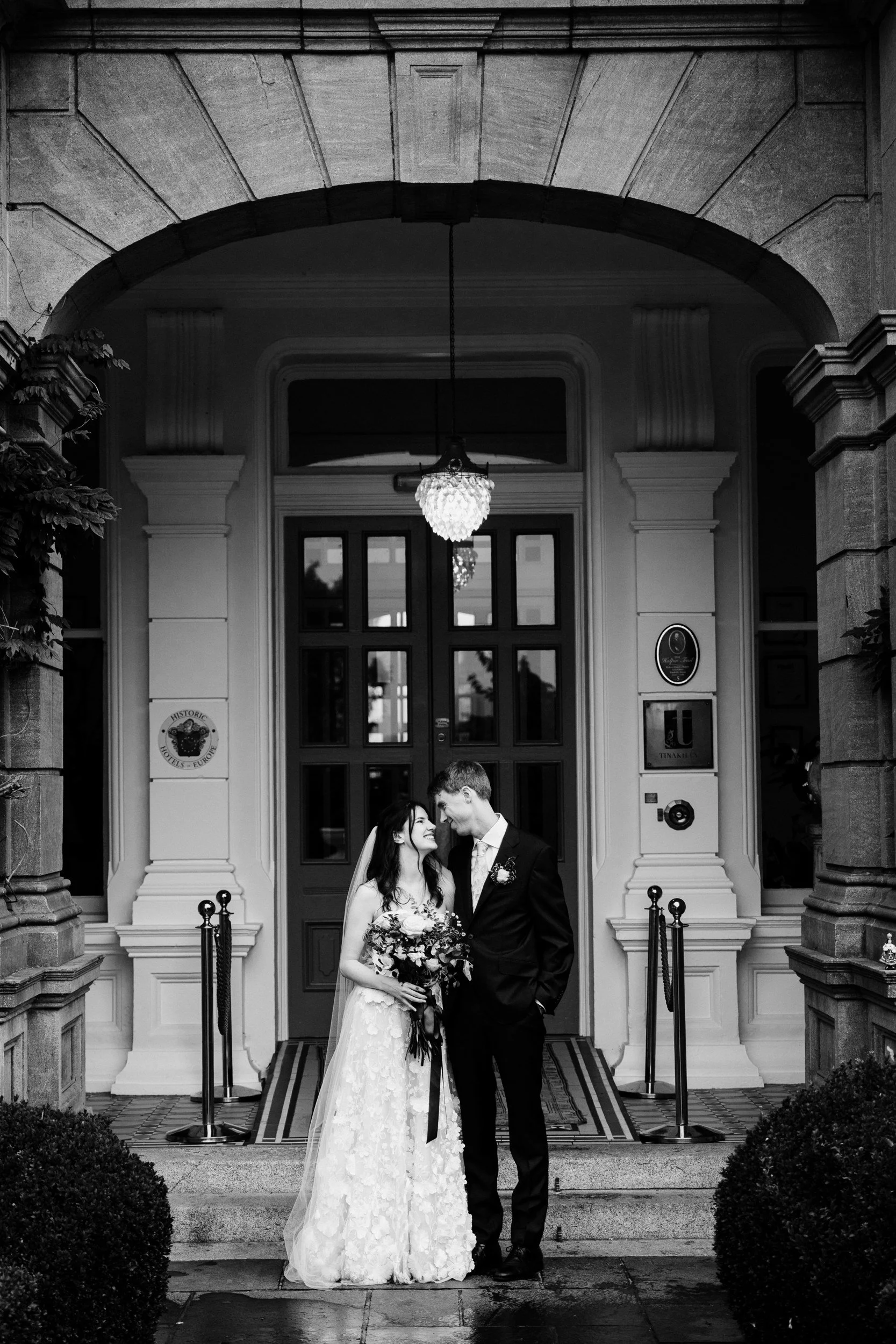 tinakilly-wedding-photographer-laura-james-50-kiss-at-the-front-door.jpg