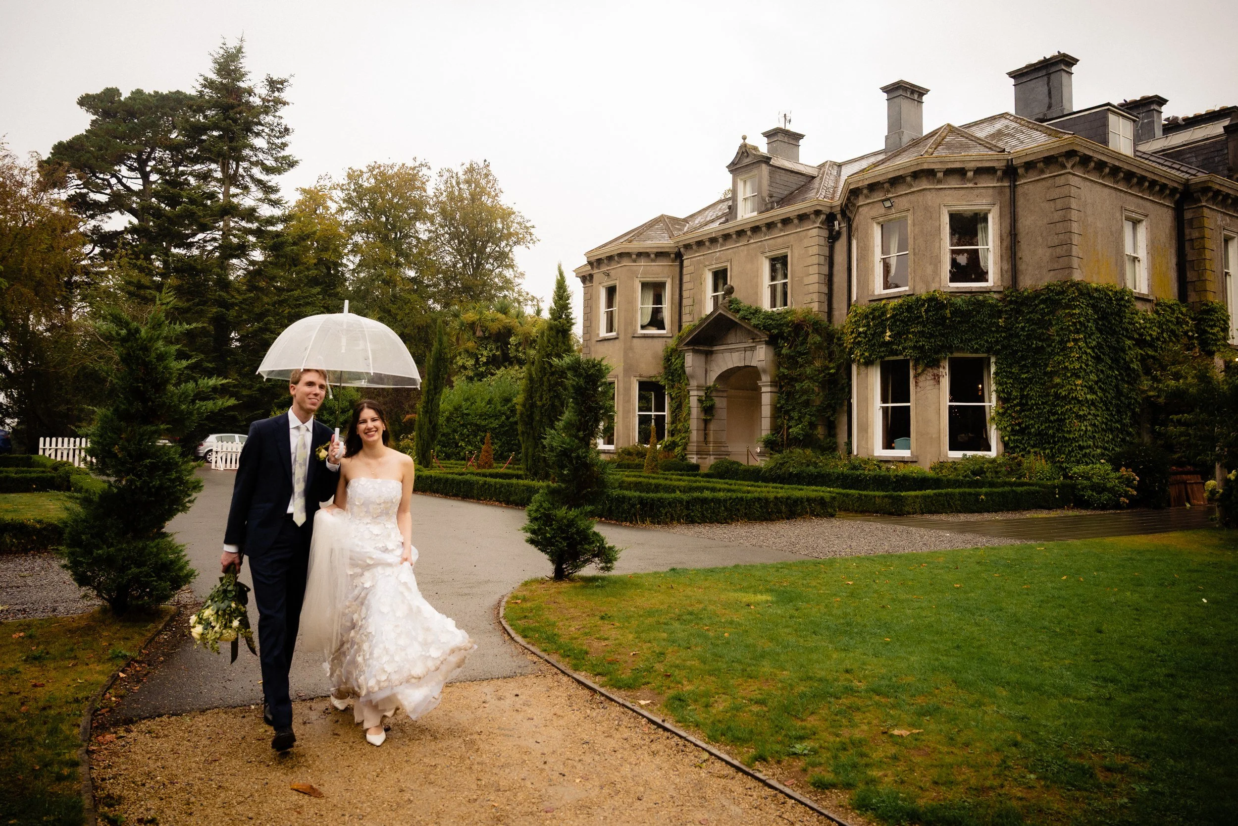 tinakilly-wedding-photographer-laura-james-51-walking-up-the-driveway.jpg