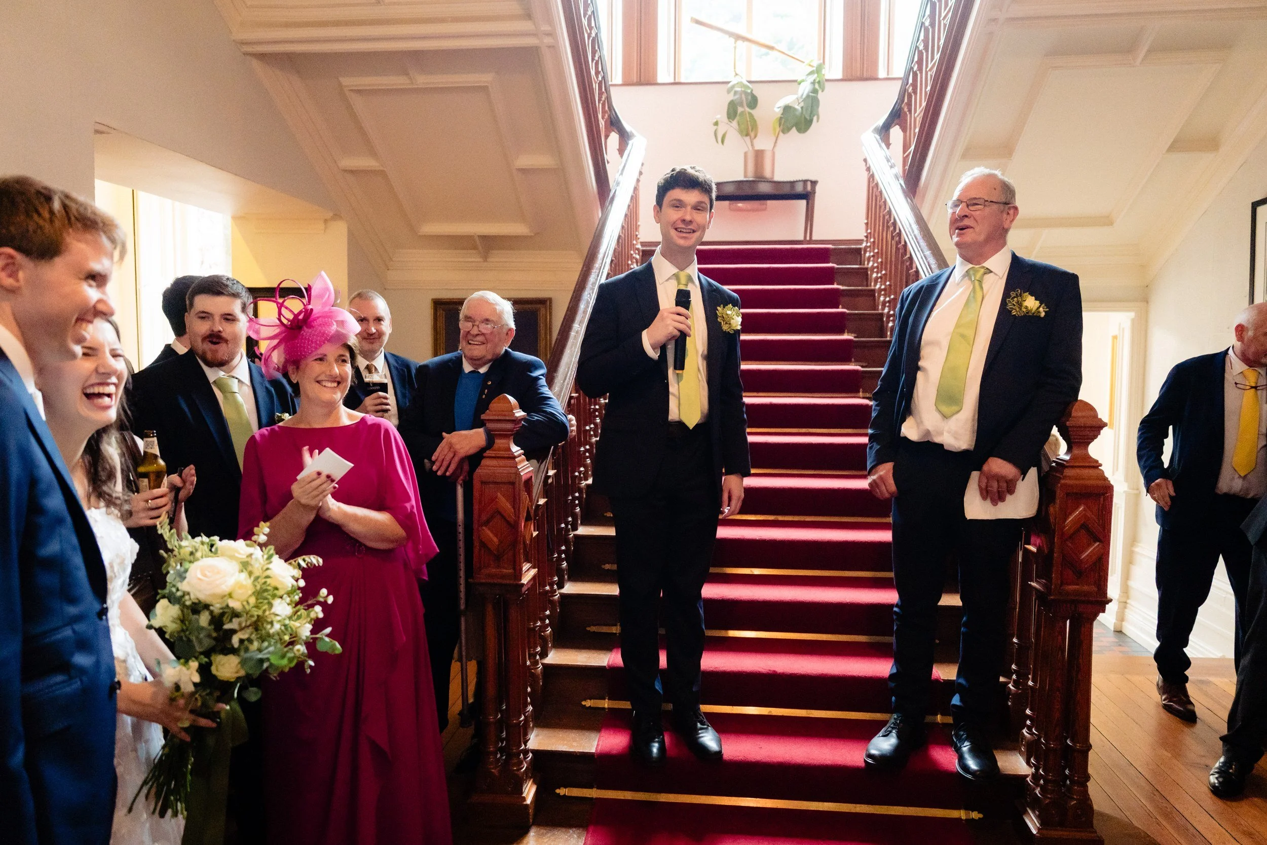tinakilly-wedding-photographer-laura-james-52-james-speaking-on-the-staircase.jpg