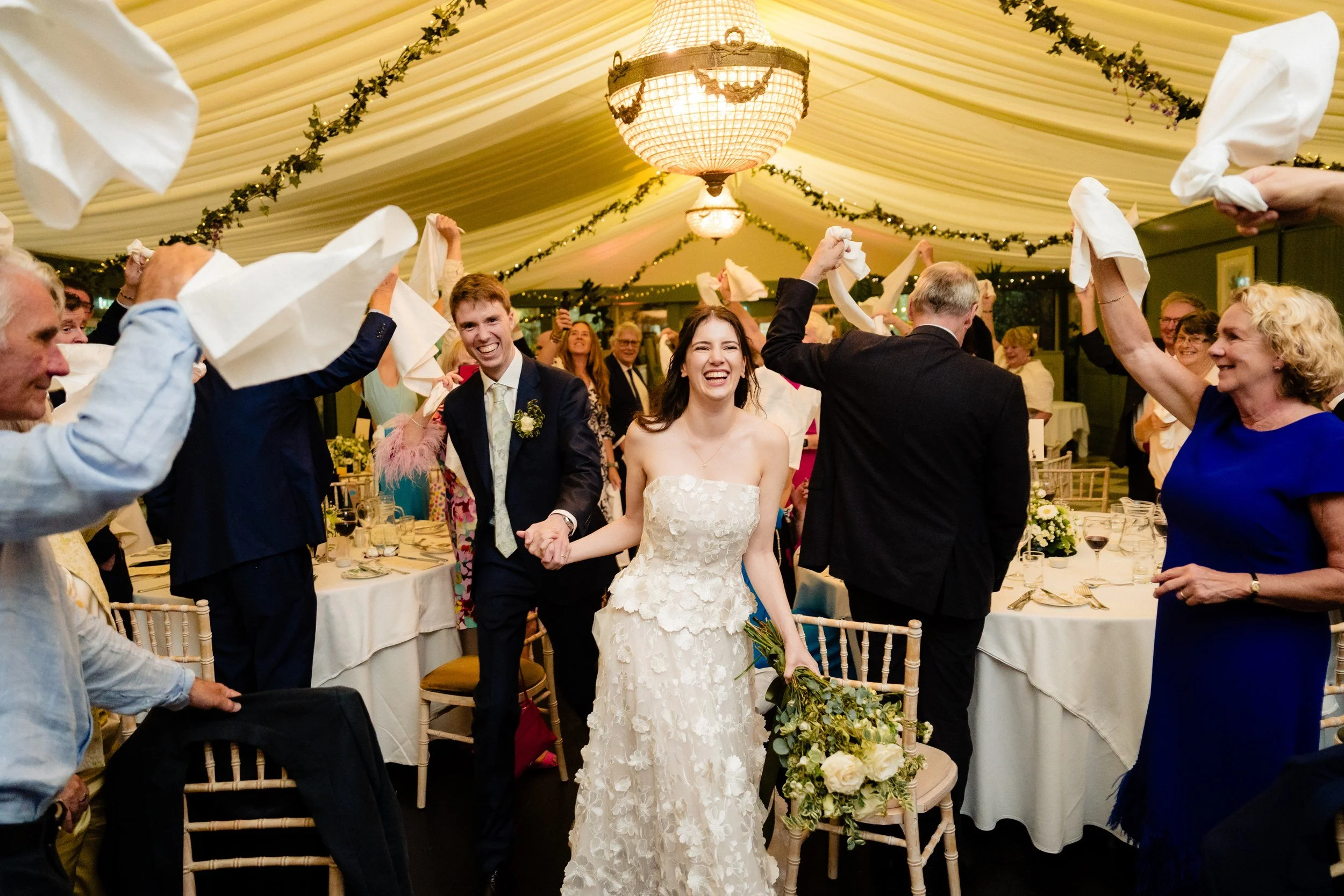 tinakilly-wedding-photographer-laura-james-60-napkins-in-the-air.jpg