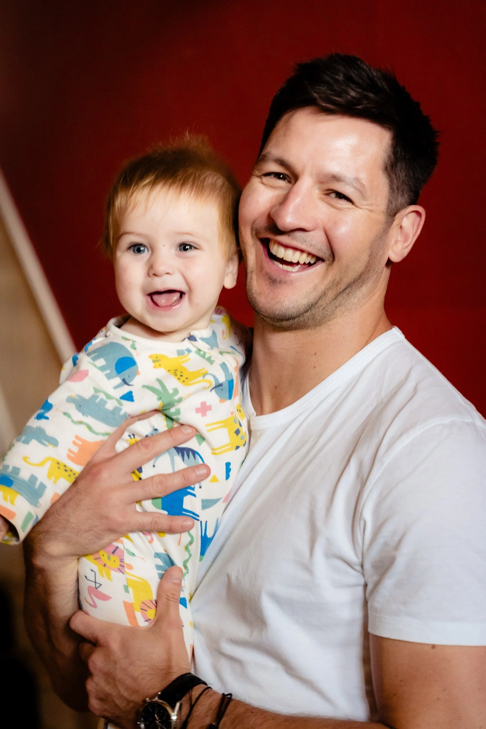 rathsallagh-wedding-photographer-niamh-john-11-dad-holding-baby.jpg