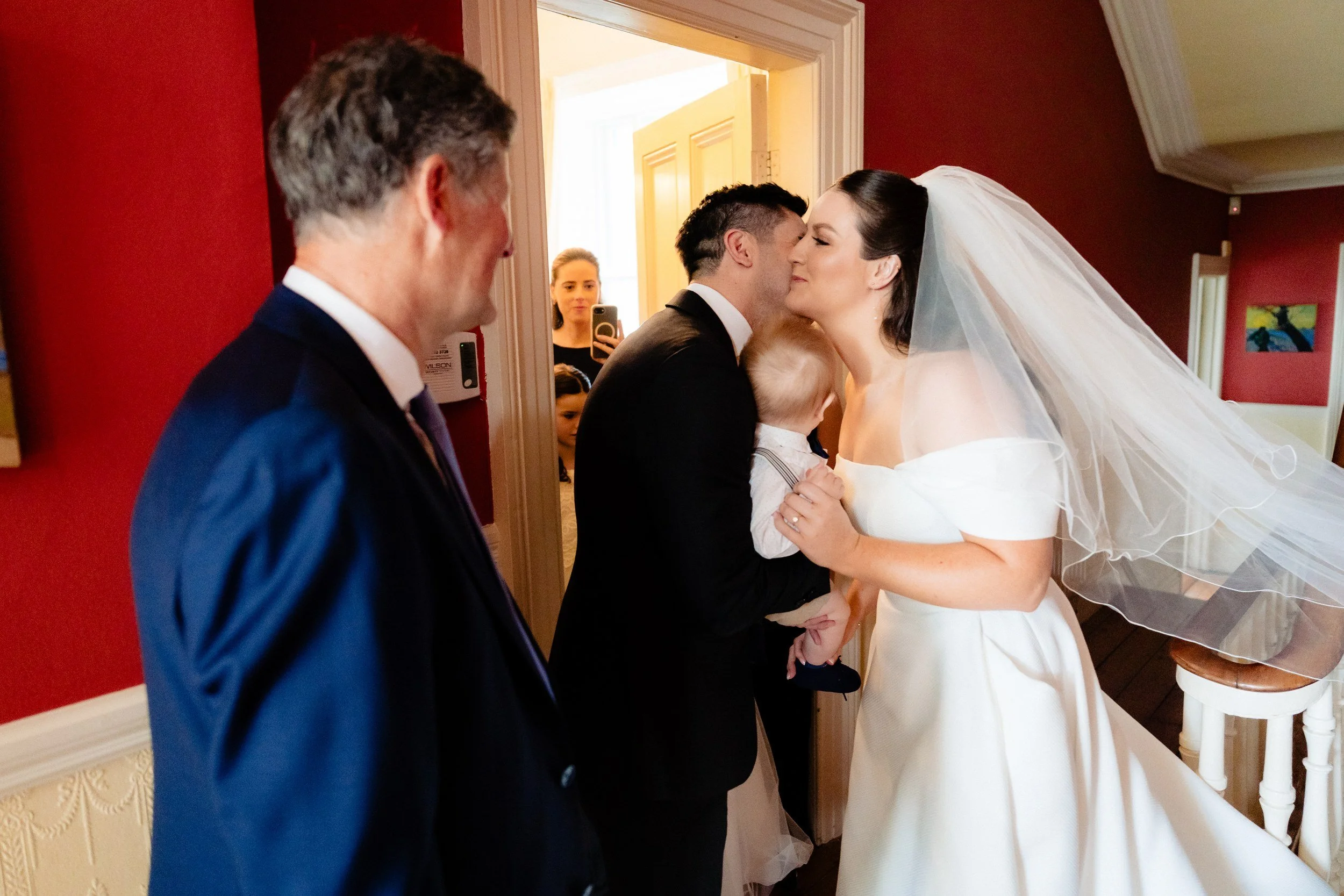rathsallagh-wedding-photographer-niamh-john-23-kiss-hallway.jpg