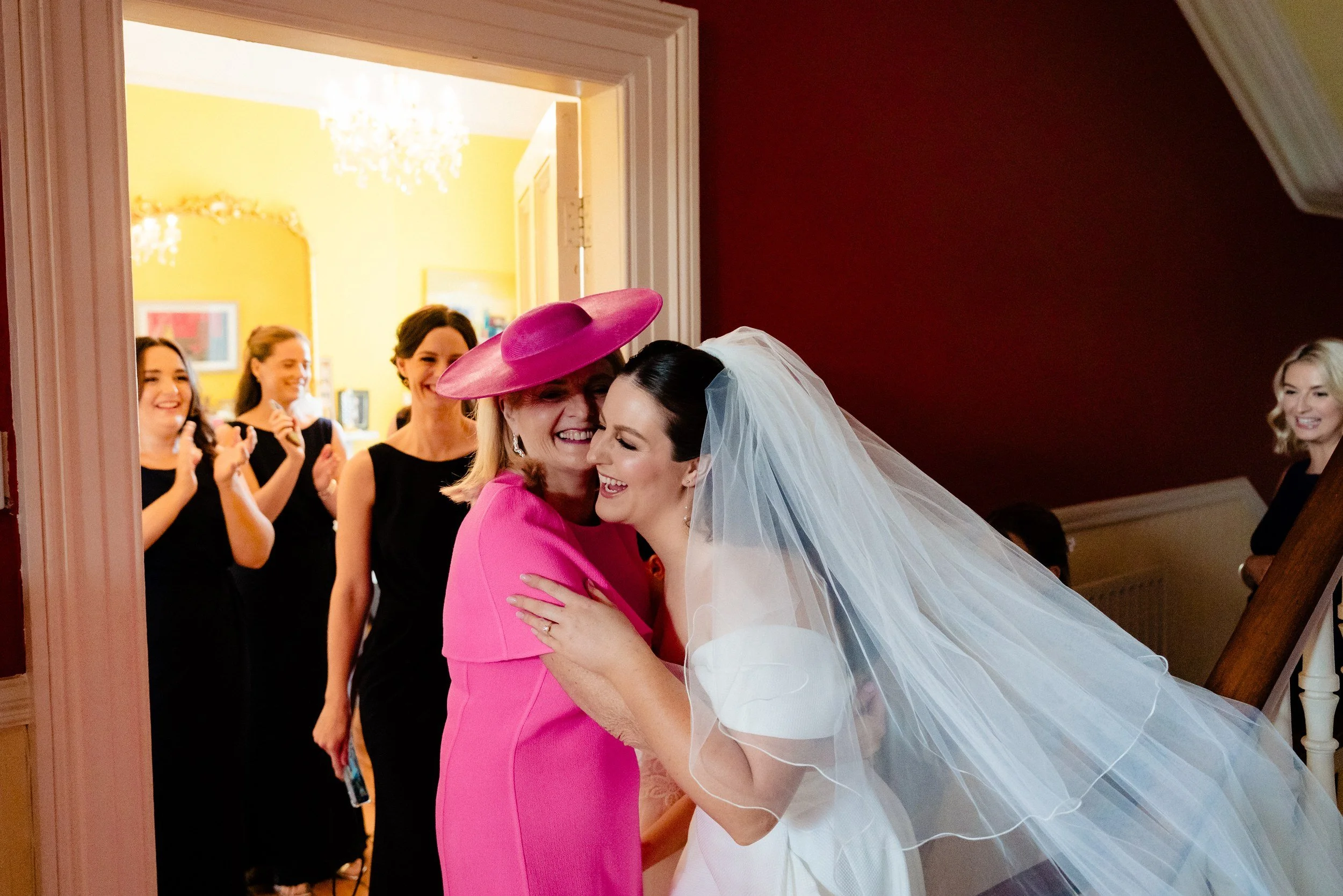 rathsallagh-wedding-photographer-niamh-john-25-mother-hug-hallway.jpg