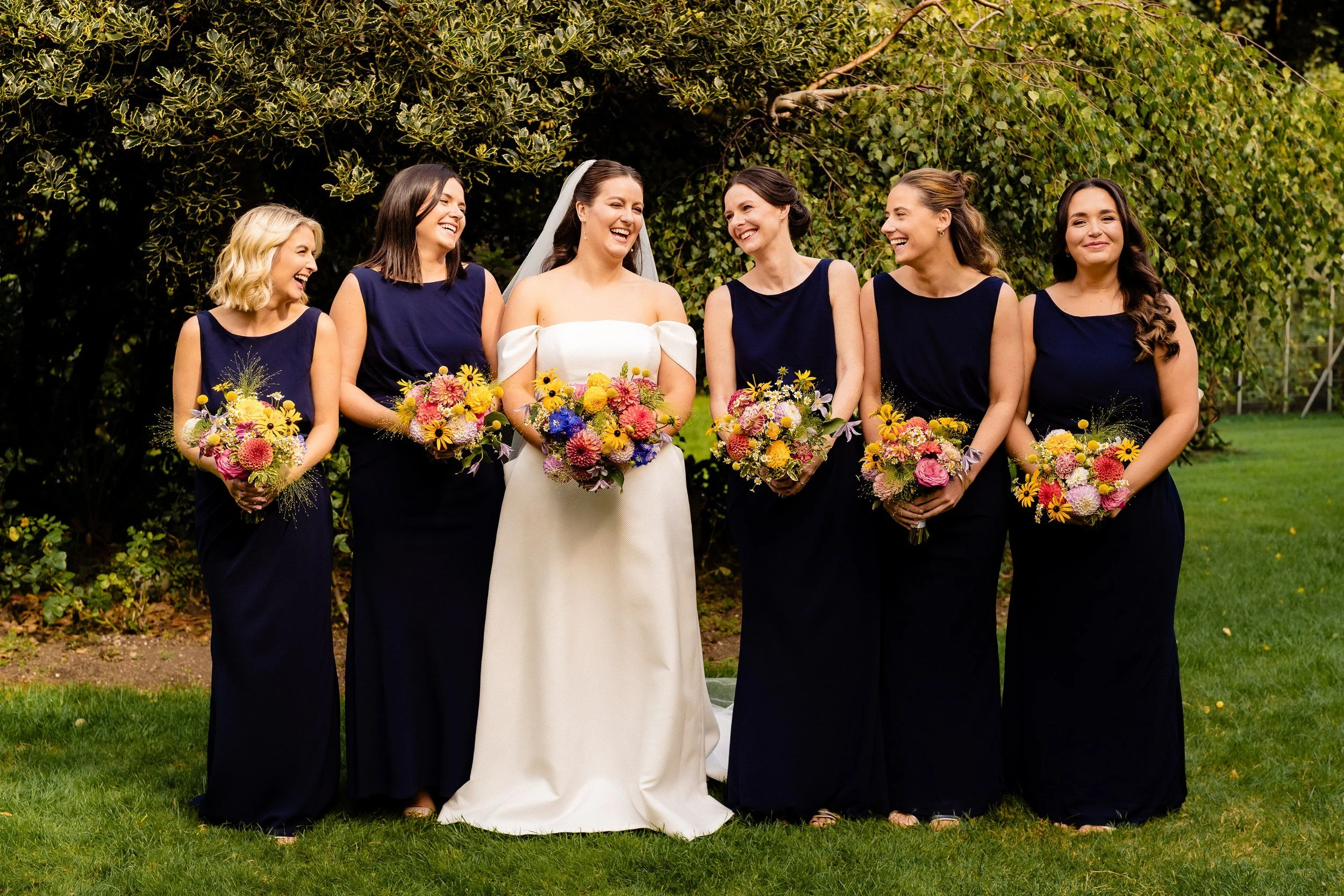 rathsallagh-wedding-photographer-niamh-john-28-bridesmaids-laughing-garden.jpg