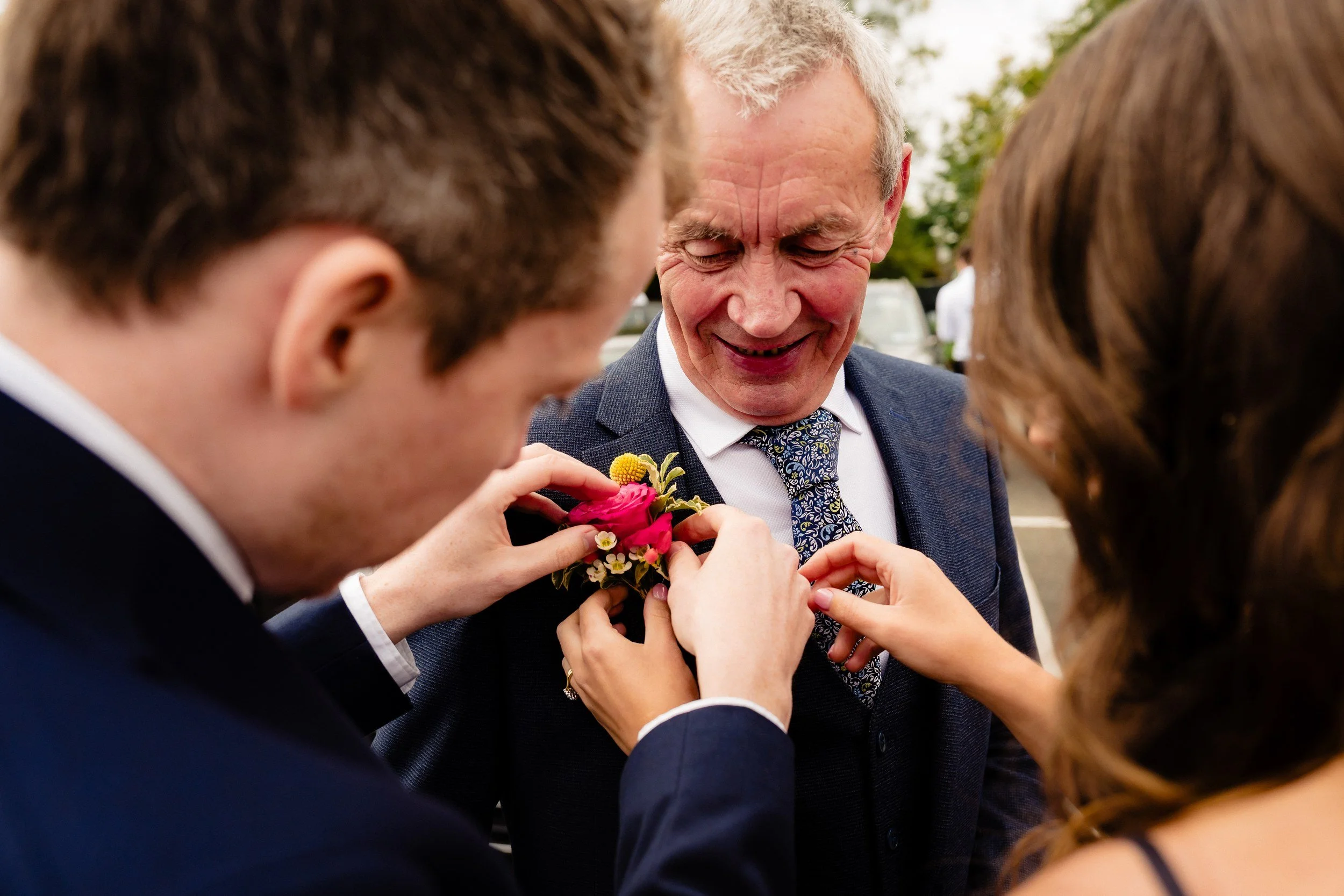 rathsallagh-wedding-photographer-niamh-john-31-buttonhole-pinning.jpg