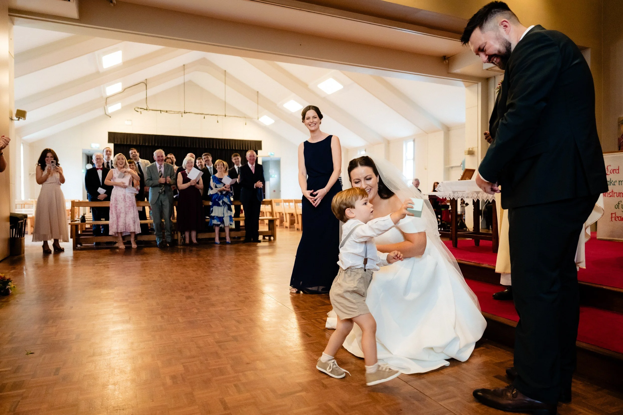 rathsallagh-wedding-photographer-niamh-john-44-page-boy-runs-to-bride.jpg