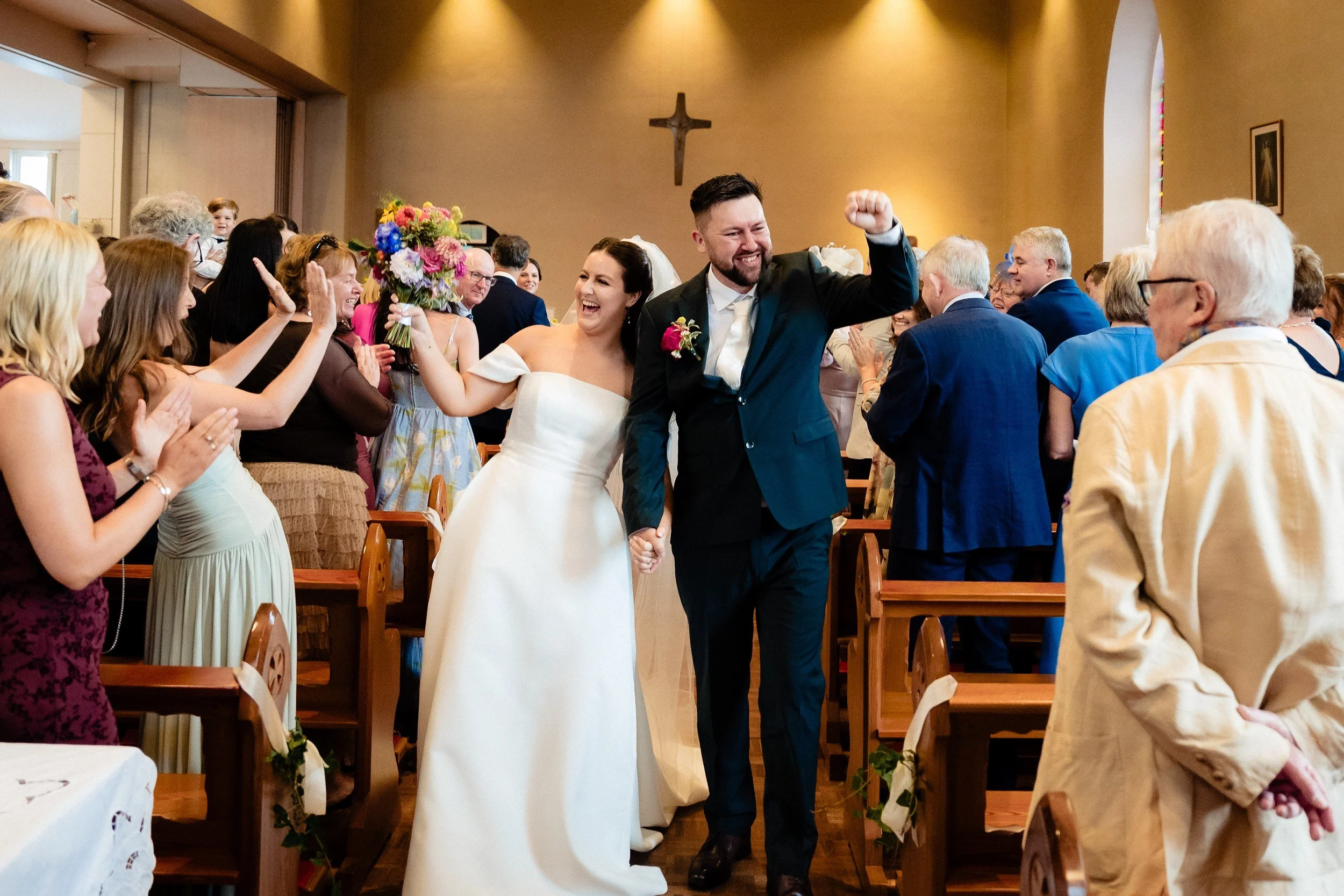 rathsallagh-wedding-photographer-niamh-john-51-fist-pump-aisle.jpg