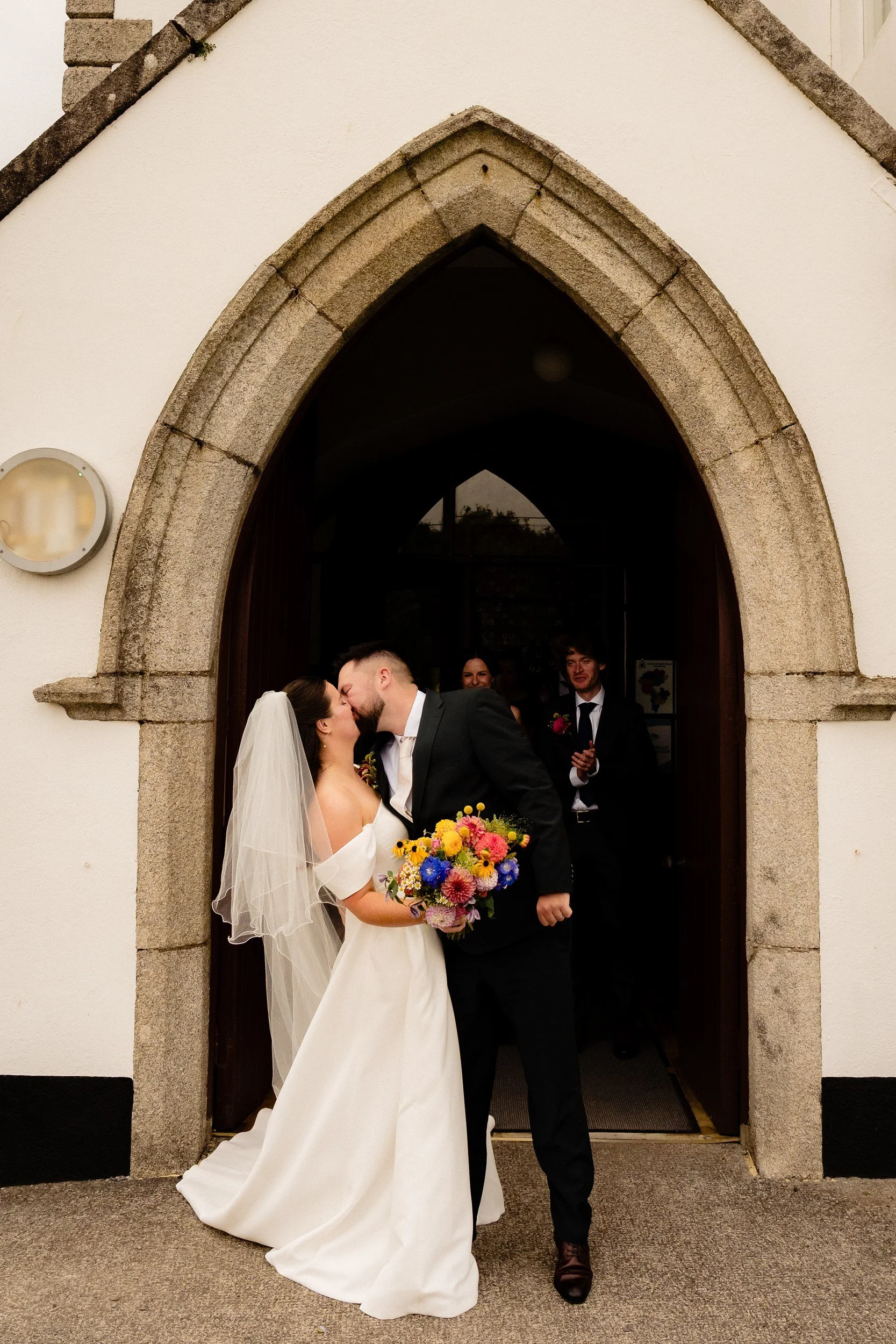 rathsallagh-wedding-photographer-niamh-john-53-kiss-church-door.jpg