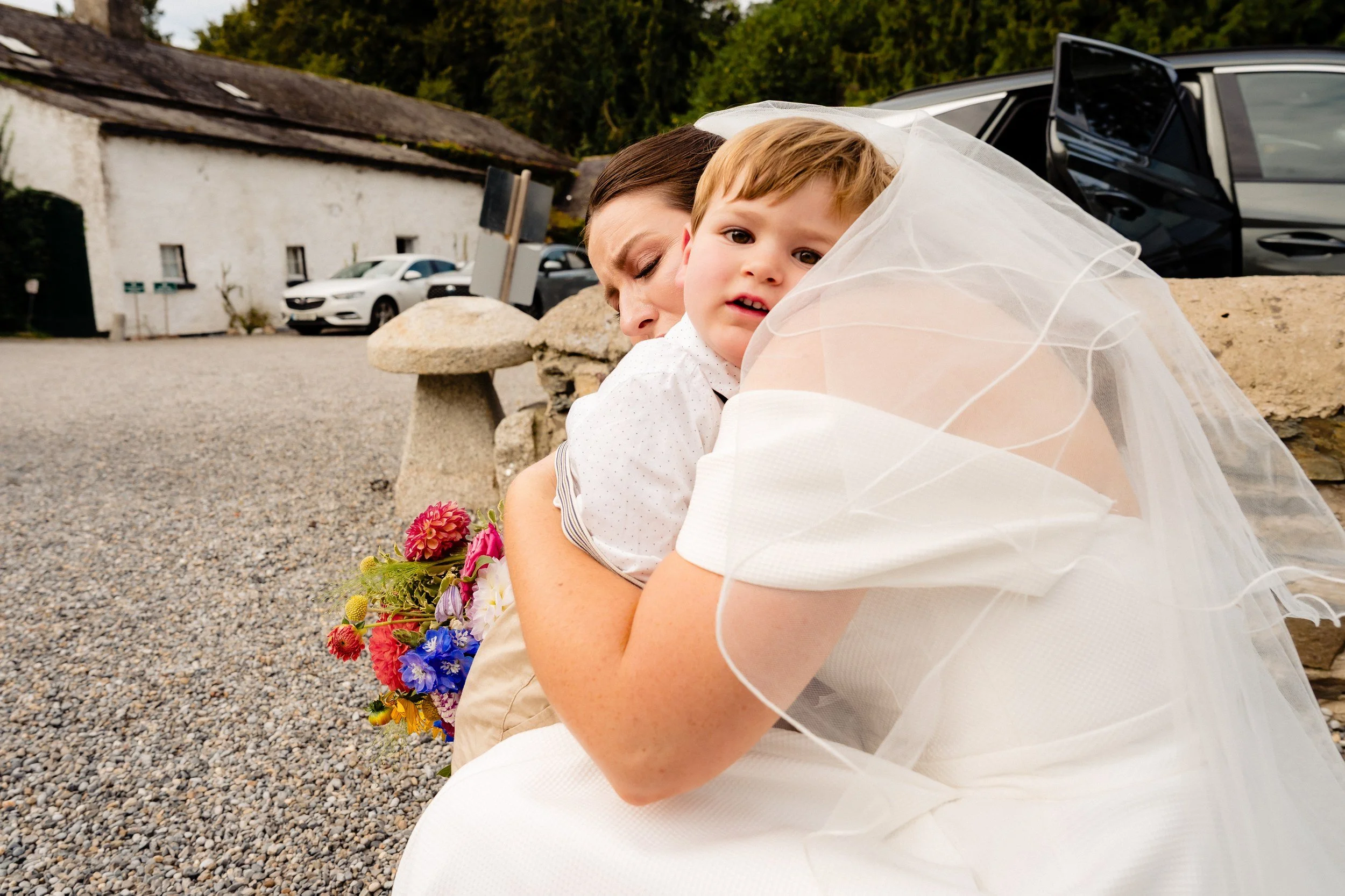 rathsallagh-wedding-photographer-niamh-john-61-page-boy-hug-arrival.jpg