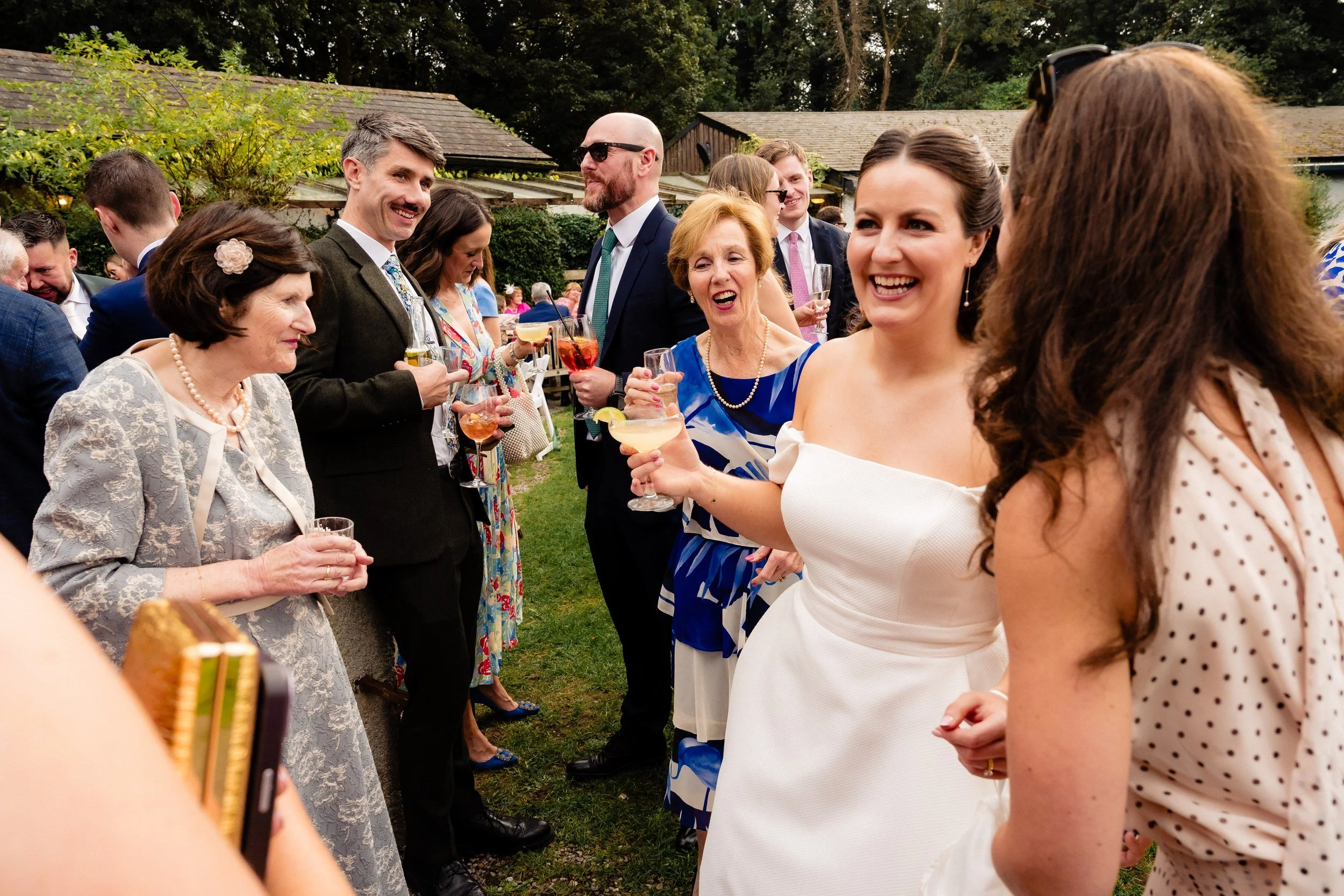 rathsallagh-wedding-photographer-niamh-john-66-bride-guests-lawn.jpg