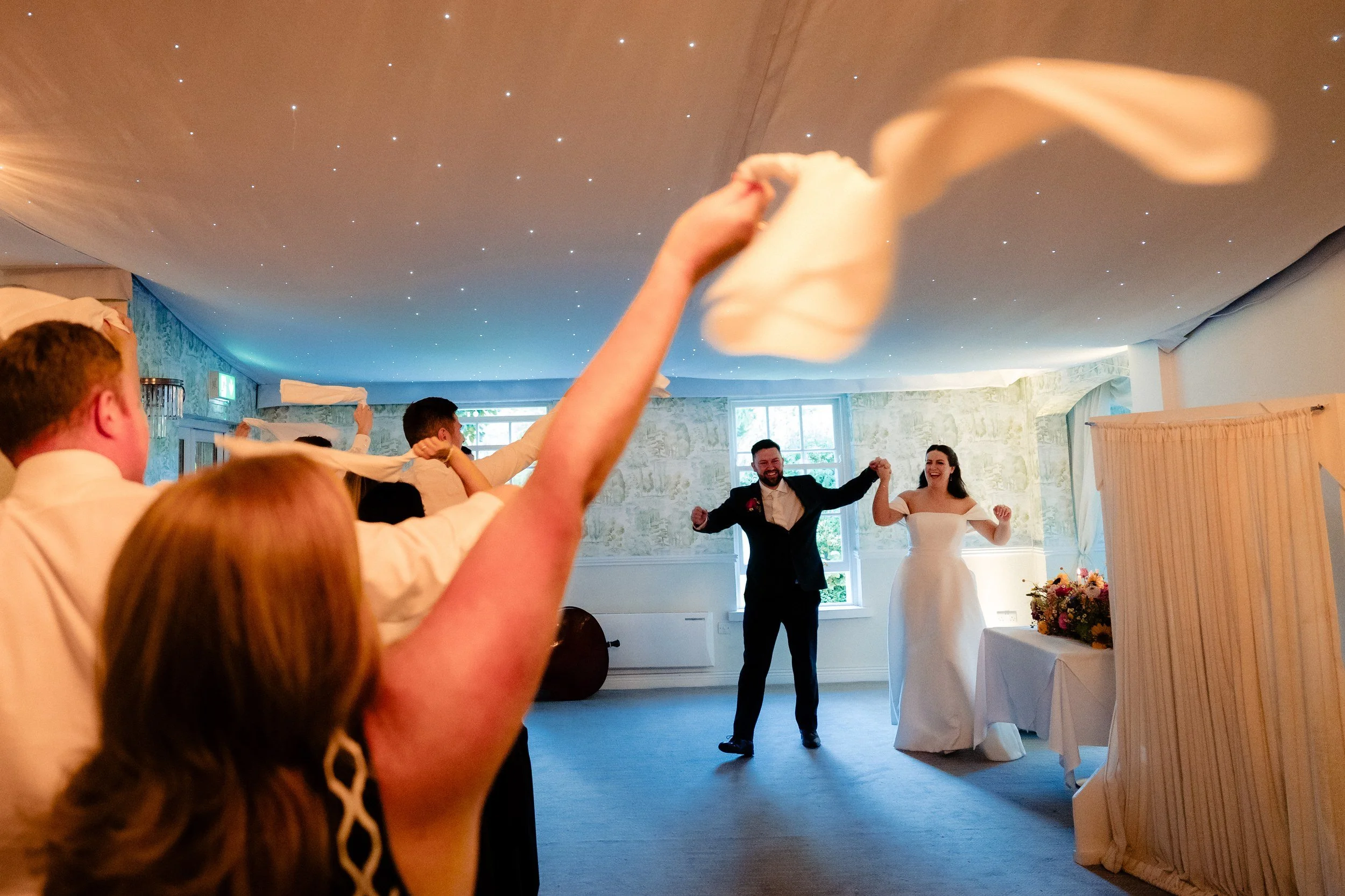 rathsallagh-wedding-photographer-niamh-john-78-napkin-waving-entrance.jpg