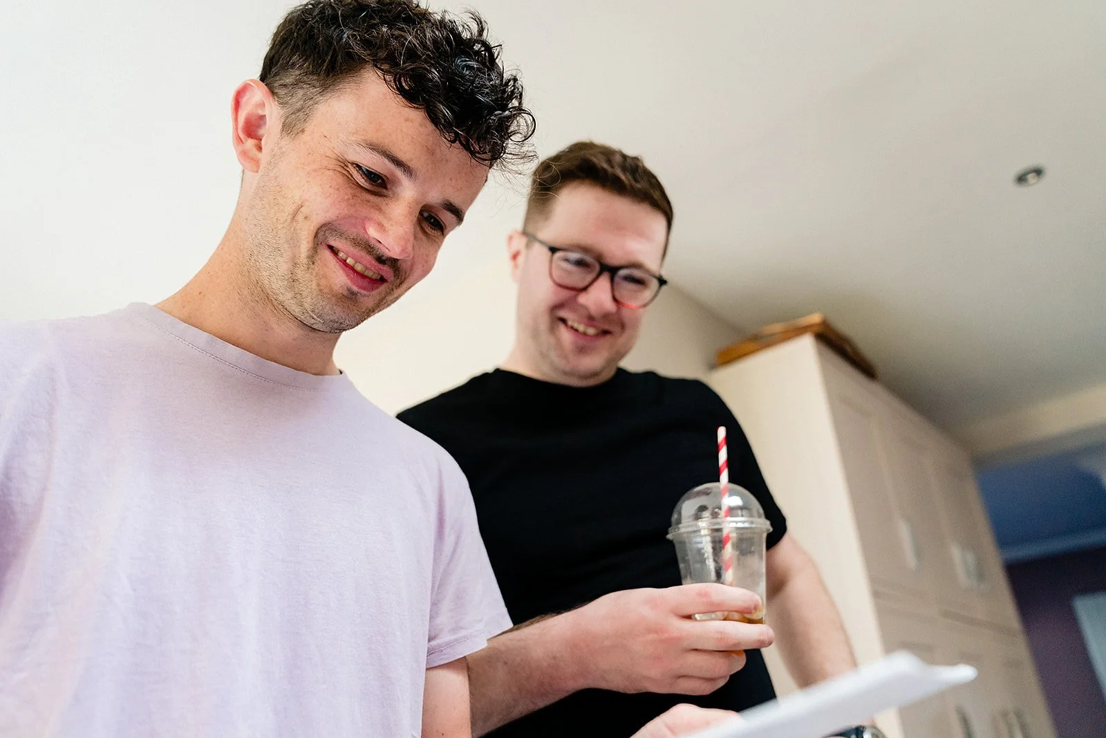 marco-pierre-white-wedding-photographer-elle-iain-02-iain-and-groomsman-laughing-in-kitchen.jpg