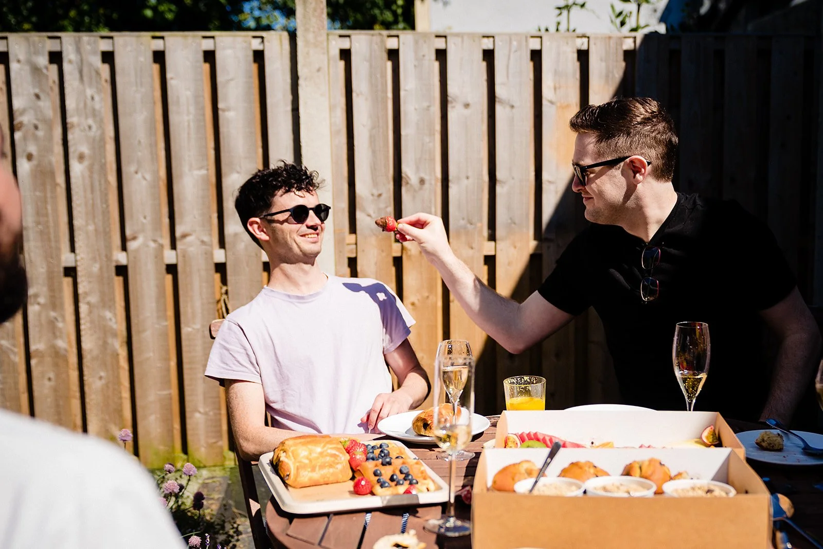 marco-pierre-white-wedding-photographer-elle-iain-06-iain-in-sunglasses-with-groomsmen-in-garden.jpg