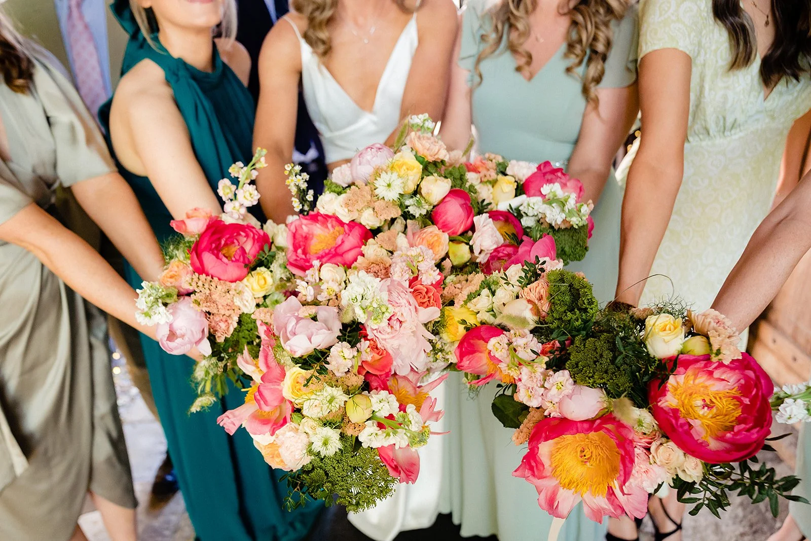 marco-pierre-white-wedding-photographer-elle-iain-26-bridesmaids-bouquets-in-the-courtyard.jpg