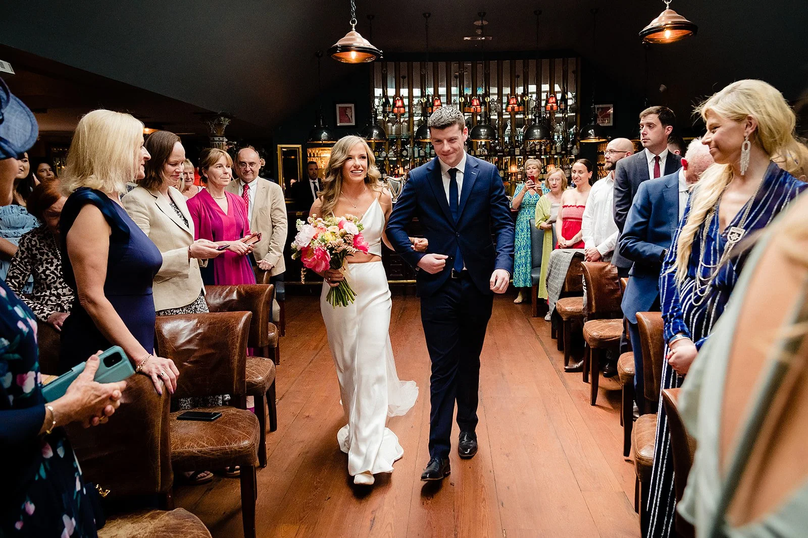 marco-pierre-white-wedding-photographer-elle-iain-30-elle-walking-in-with-her-brother.jpg