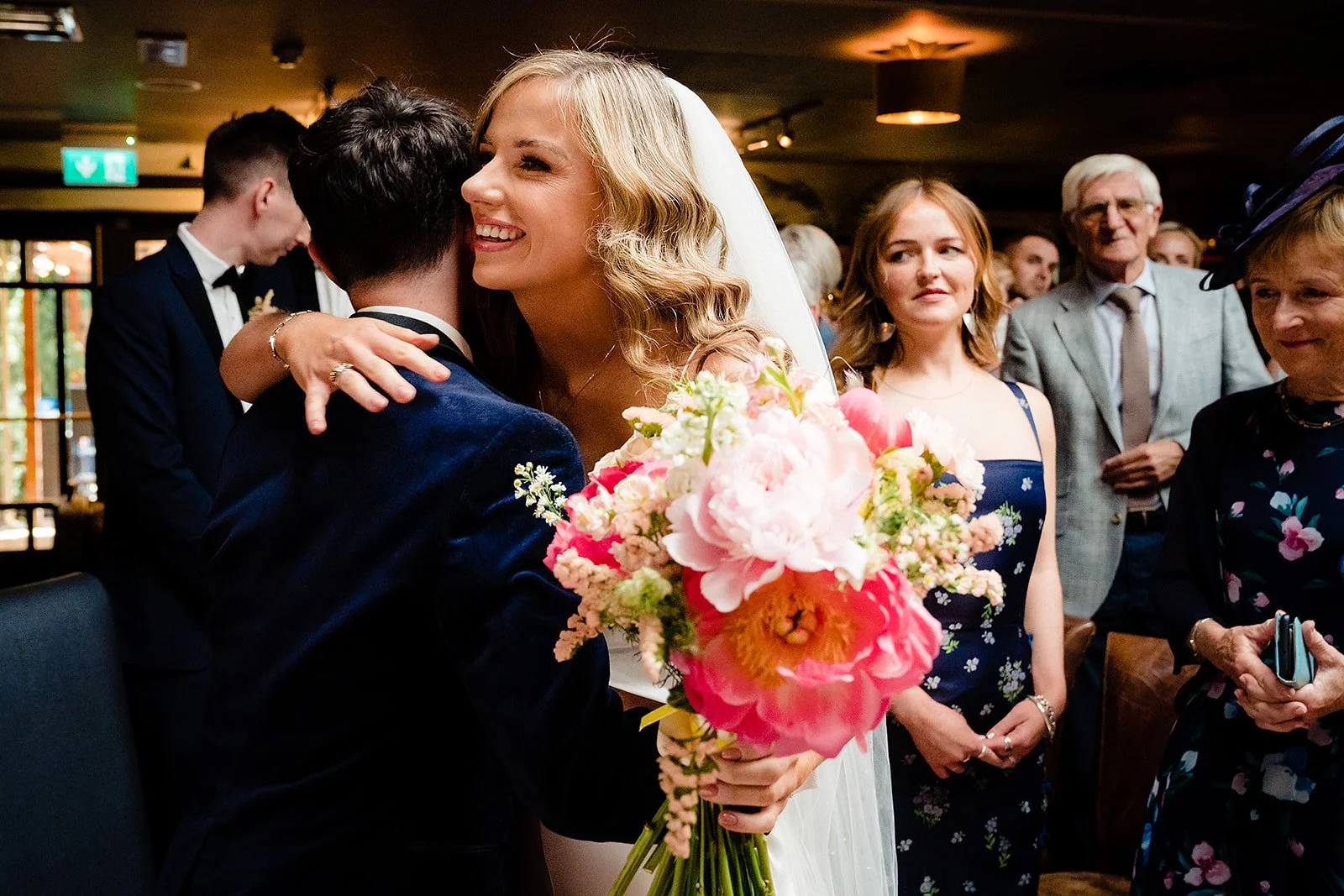 marco-pierre-white-wedding-photographer-elle-iain-32-elle-and-iain-hug-at-the-top-of-the-aisle.jpg