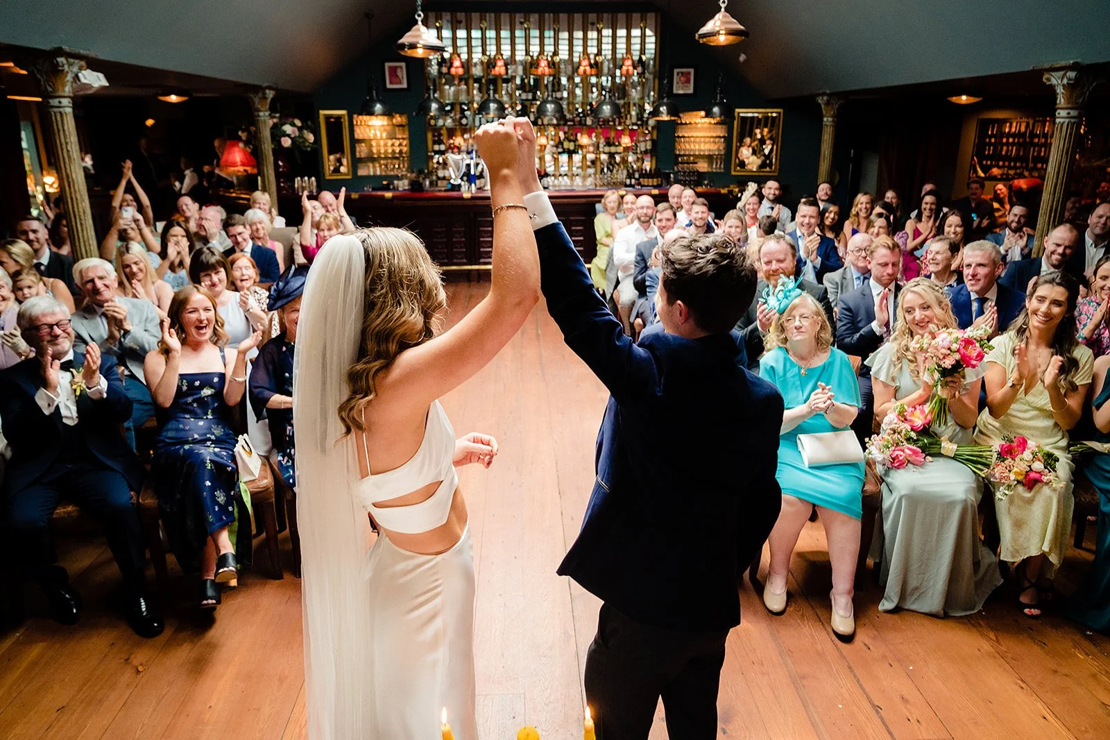 marco-pierre-white-wedding-photographer-elle-iain-39-guests-roaring-after-the-kiss.jpg