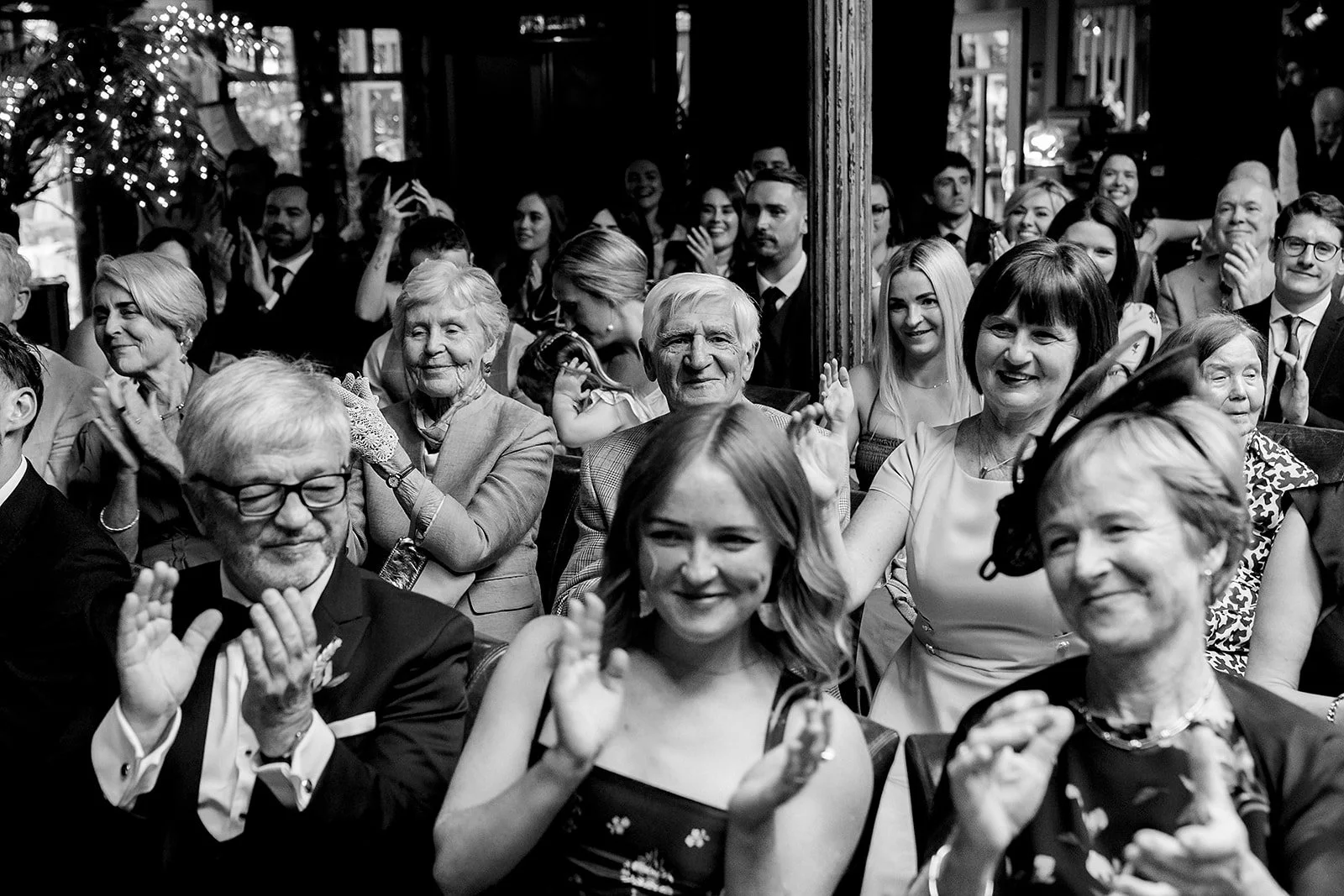 marco-pierre-white-wedding-photographer-elle-iain-40-guests-cheering-in-black-and-white.jpg