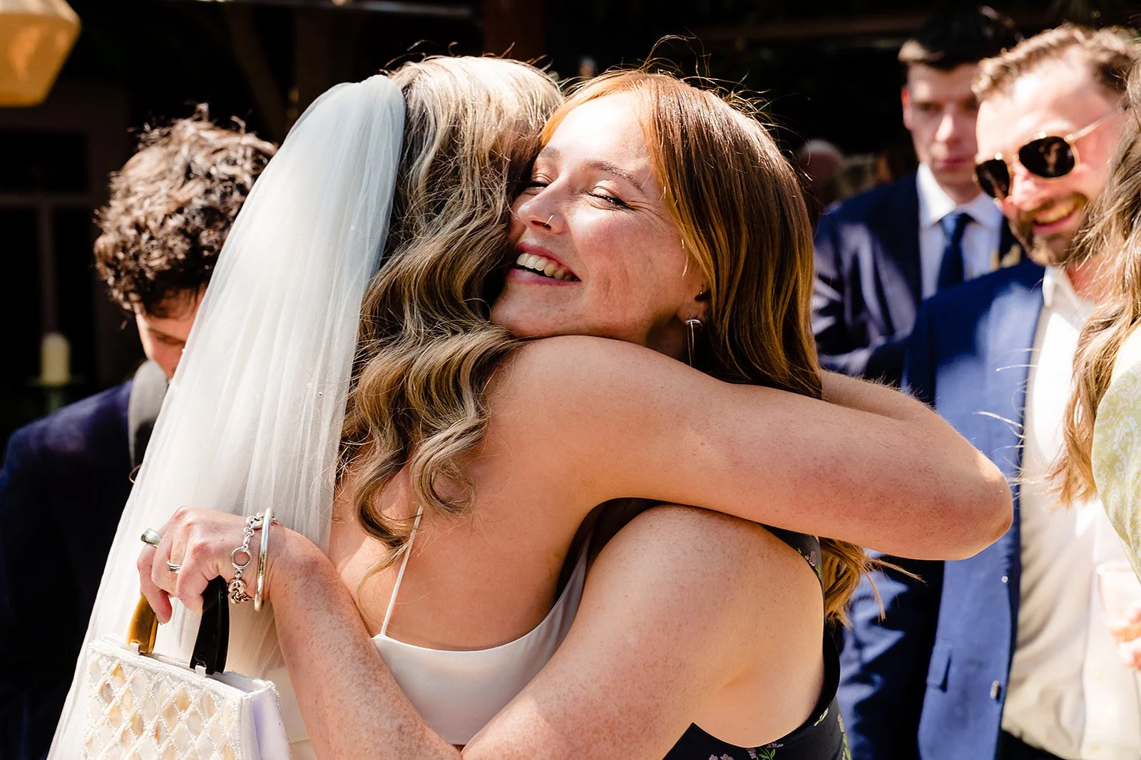 marco-pierre-white-wedding-photographer-elle-iain-44-elle-hugging-a-friend-after-the-ceremony.jpg