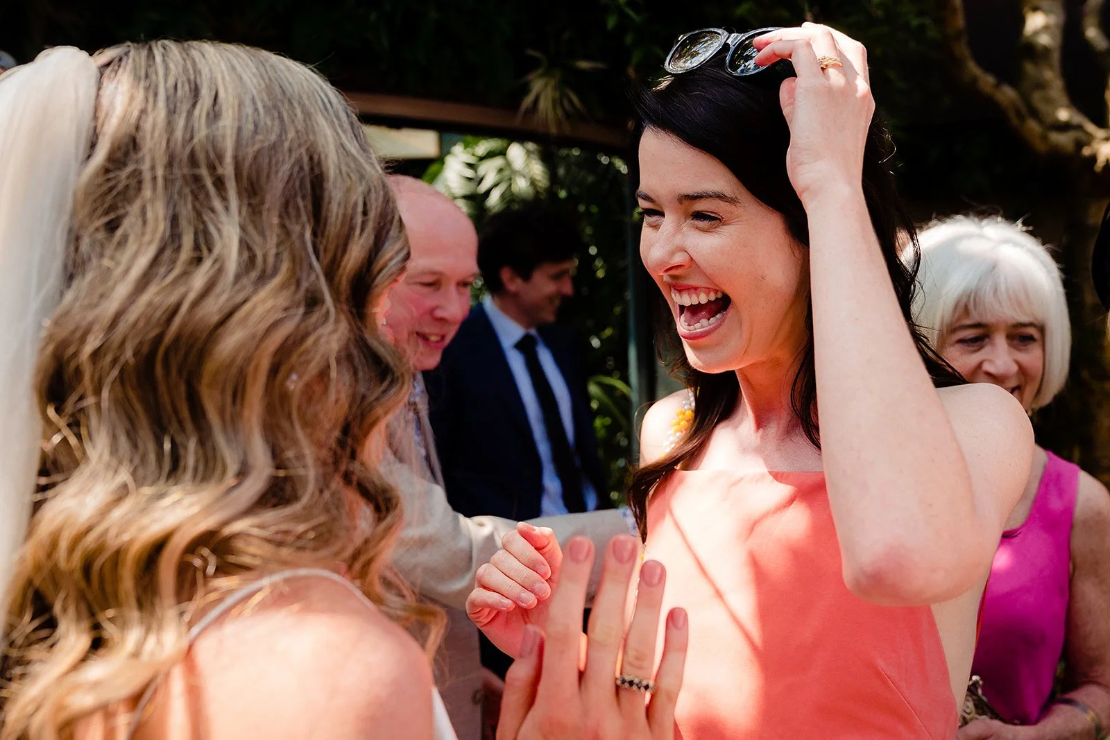 marco-pierre-white-wedding-photographer-elle-iain-46-guests-laughing-in-the-courtyard.jpg