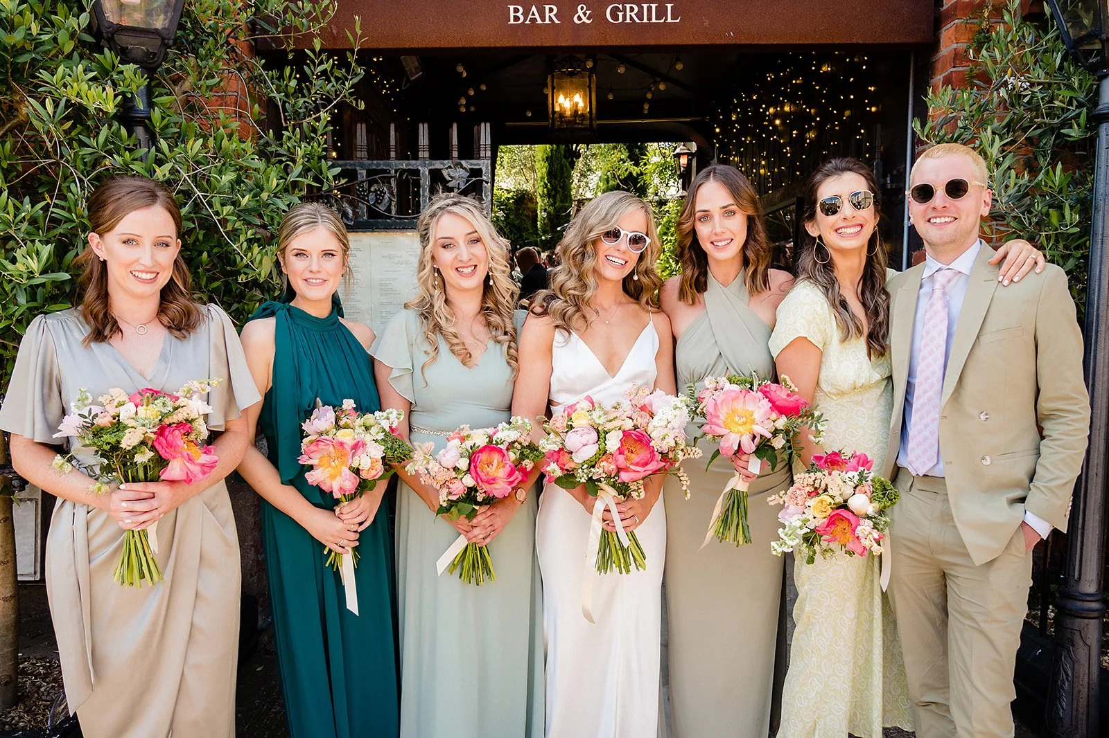 marco-pierre-white-wedding-photographer-elle-iain-52-bridesmaids-and-bridesman-outside-the-courtyard.jpg