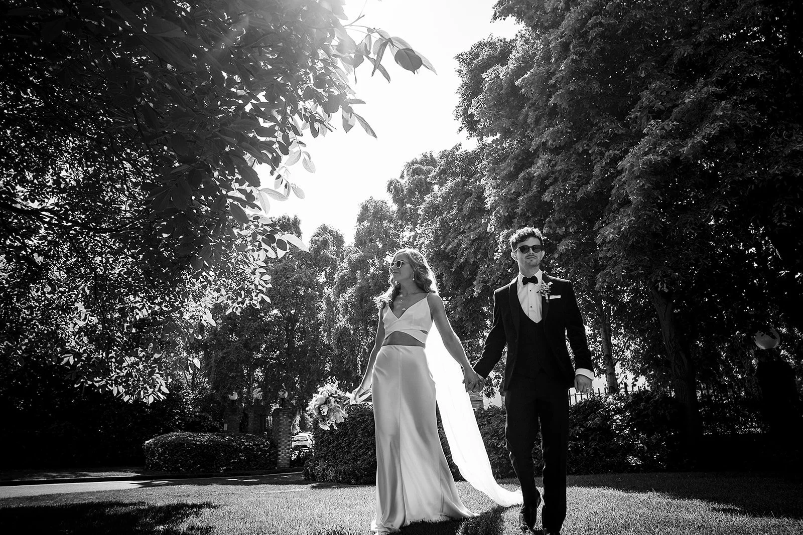 marco-pierre-white-wedding-photographer-elle-iain-59-elle-and-iain-in-the-sun-under-the-trees.jpg