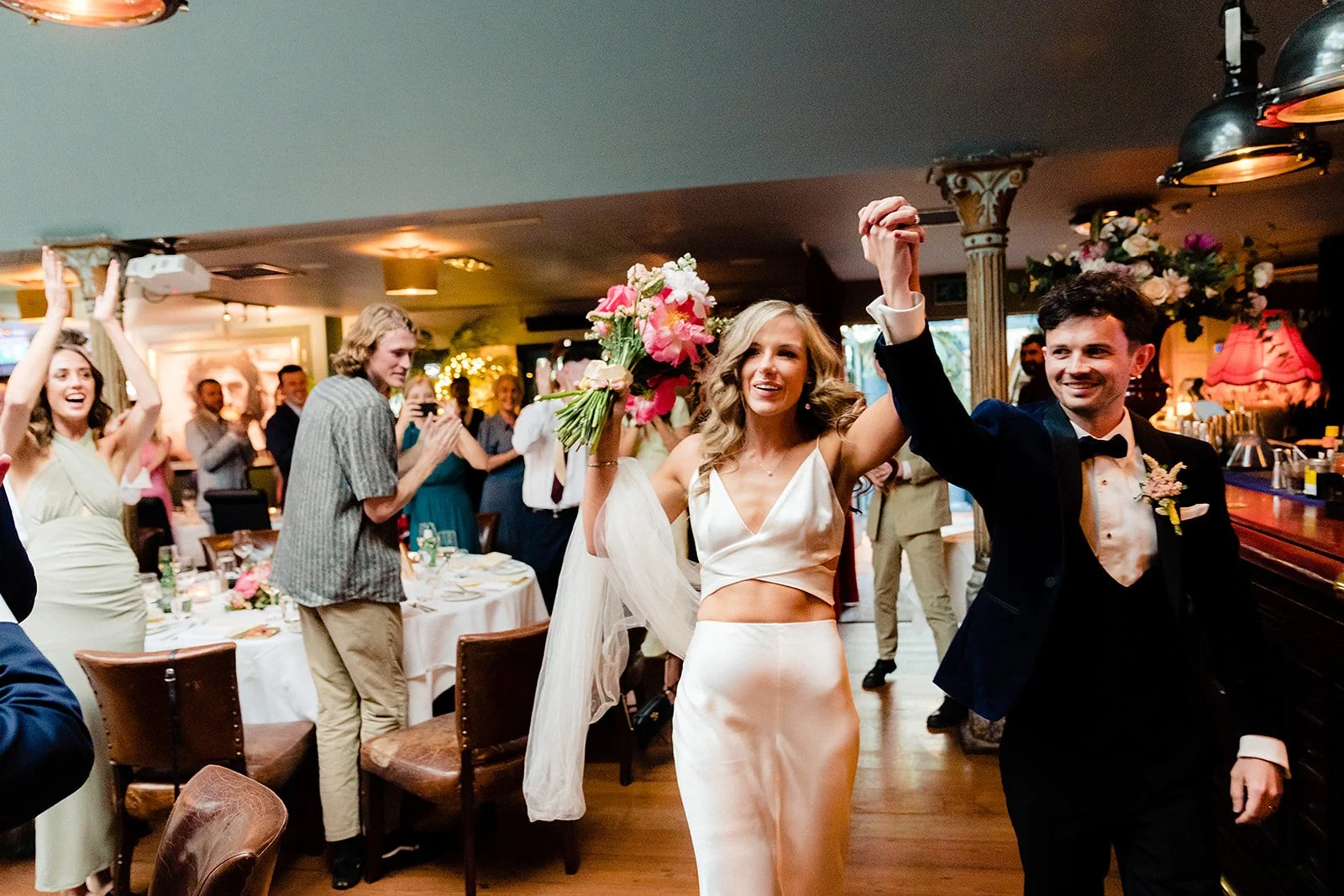 marco-pierre-white-wedding-photographer-elle-iain-64-guests-on-their-feet-as-elle-and-iain-arrive.jpg