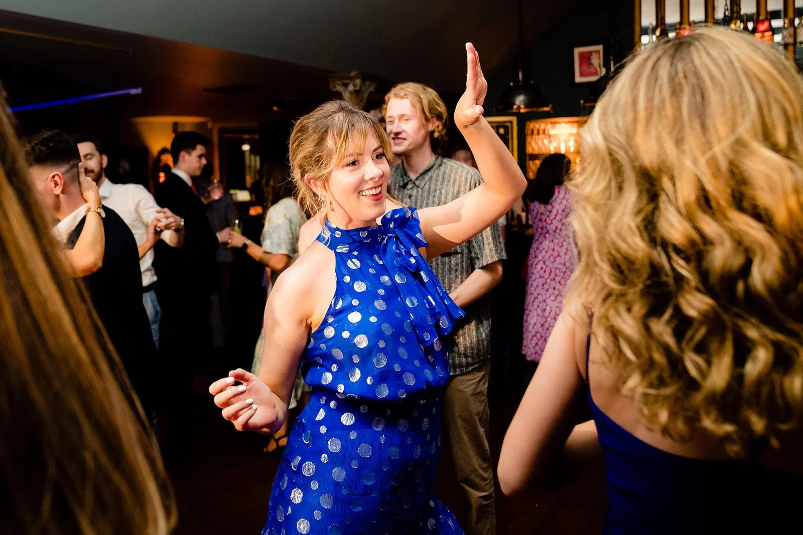 marco-pierre-white-wedding-photographer-elle-iain-77-guest-dancing-in-blue.jpg